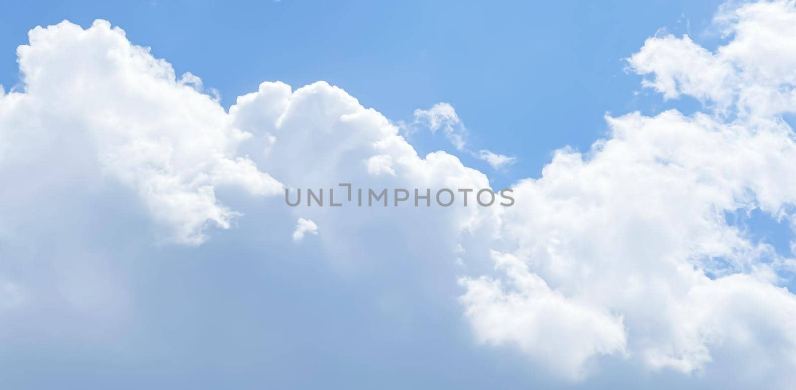 Cloudy sunny sky as abstract background, bright colours, beauty in nature concept