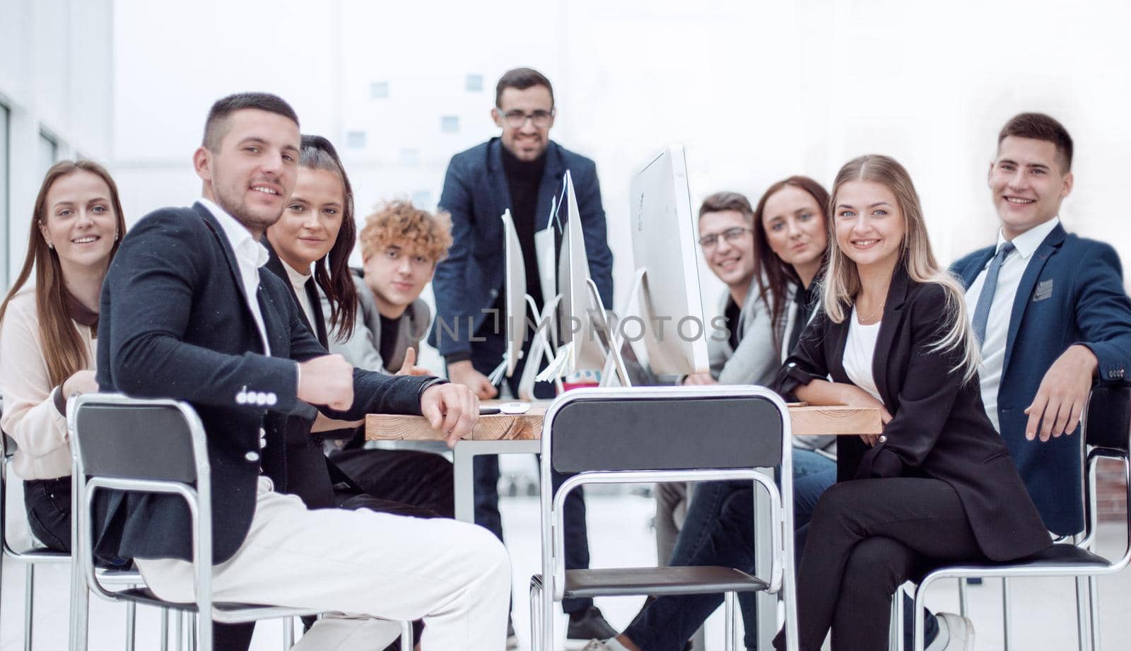 large group of employees sitting at office Desk. the concept of teamwork