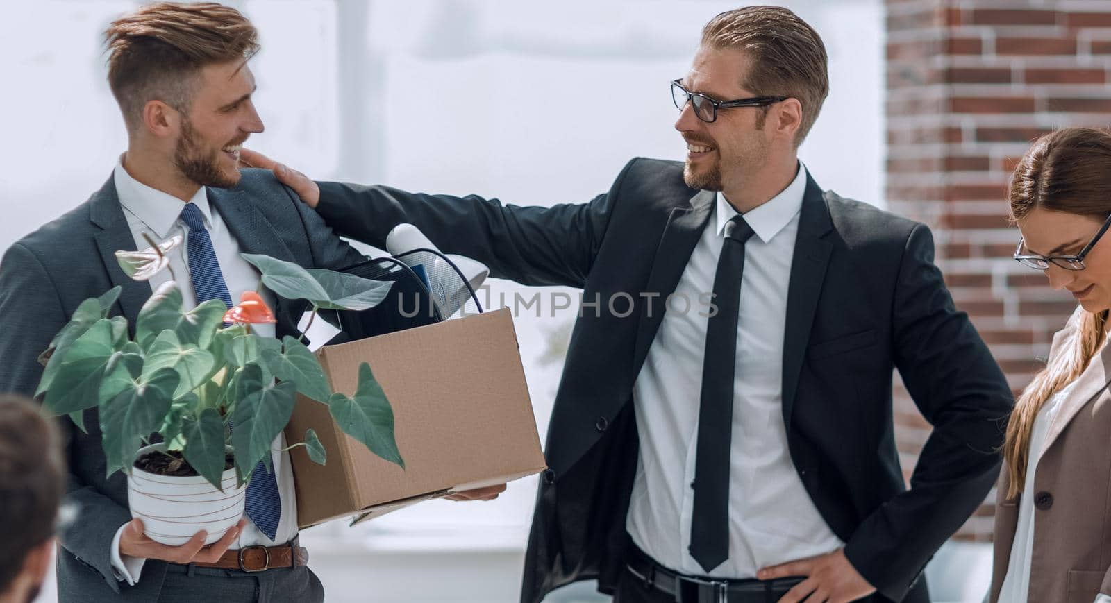 employee with personal belongings leaving the office.the concept of dismissal