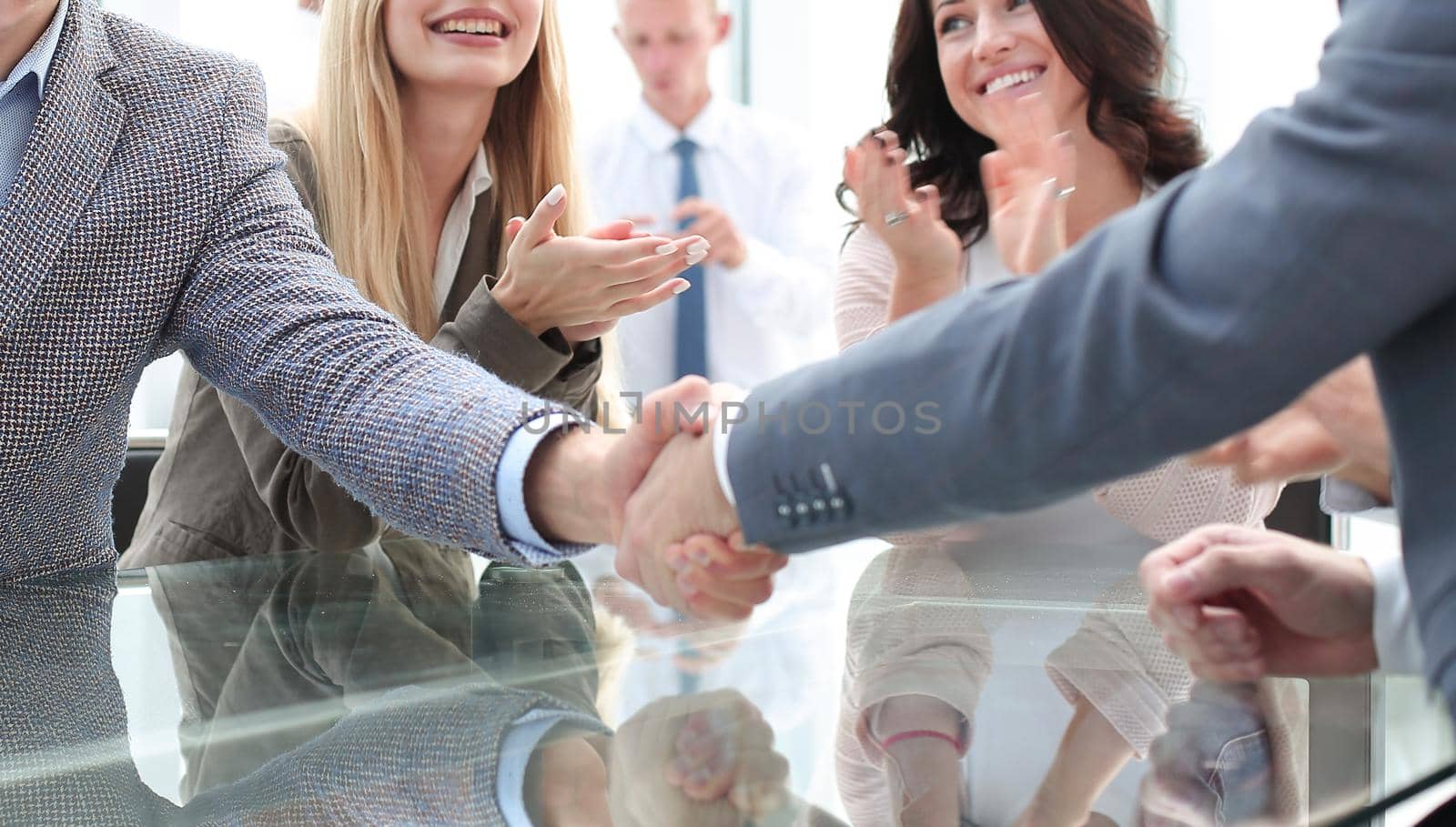 business partners shaking hands during a meeting. photo with copy space