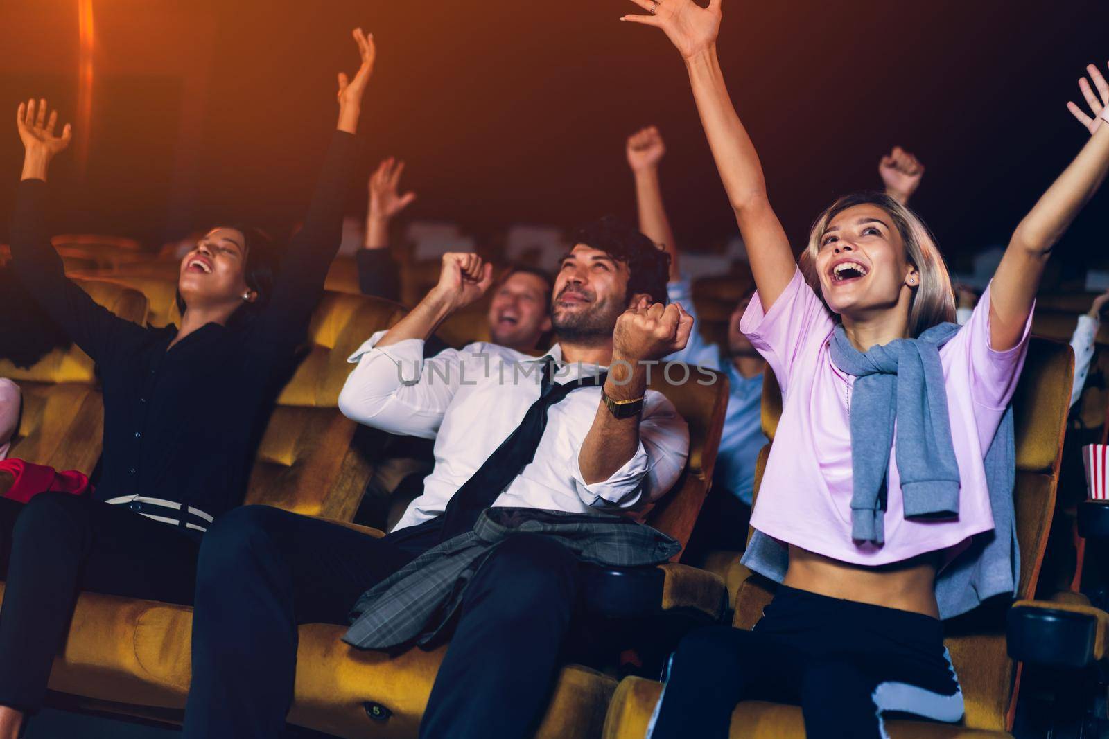 Audience is happy and exciting in movie theater cinema. Group recreation activity and entertainment concept.