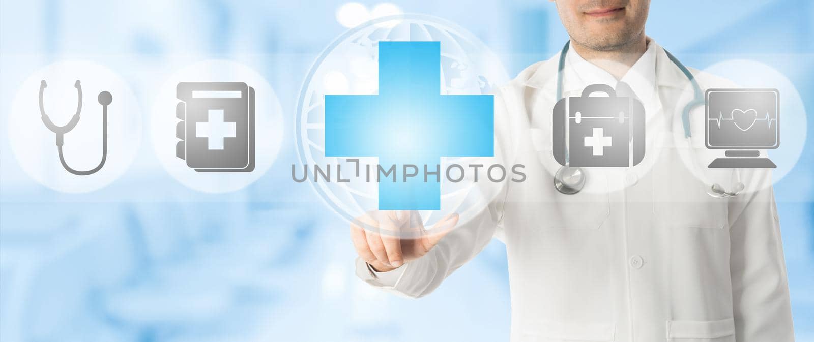Healthcare Concept - Doctor points at medical cross with other medical icons showing patient caring and health examination technology display on blue abstract background.