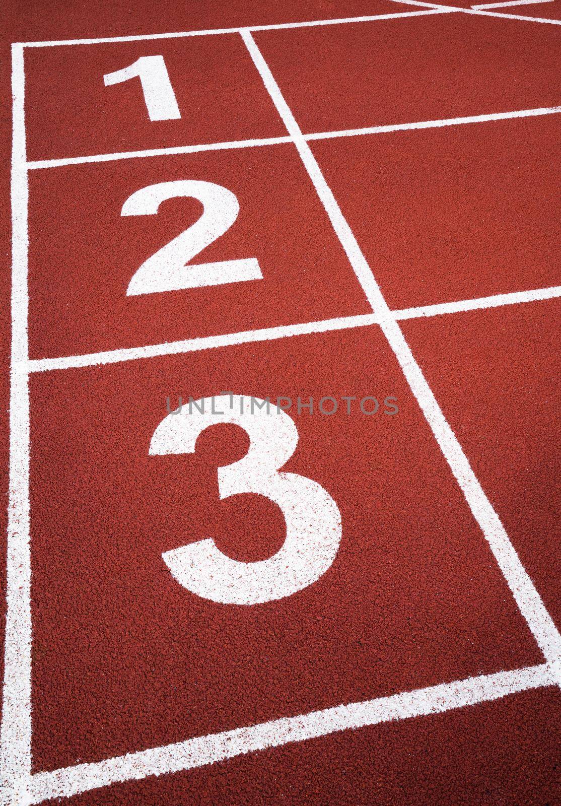 Running track number one two three in a stadium