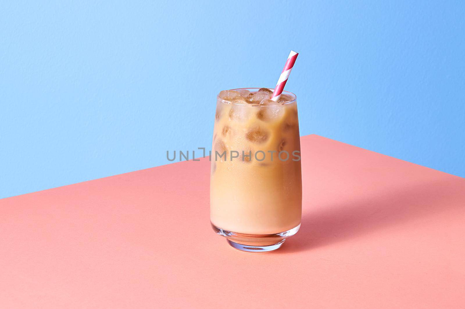 Iced Coffee with Milk in Tall Glasses on Pink Table by Svetlana_Belozerova