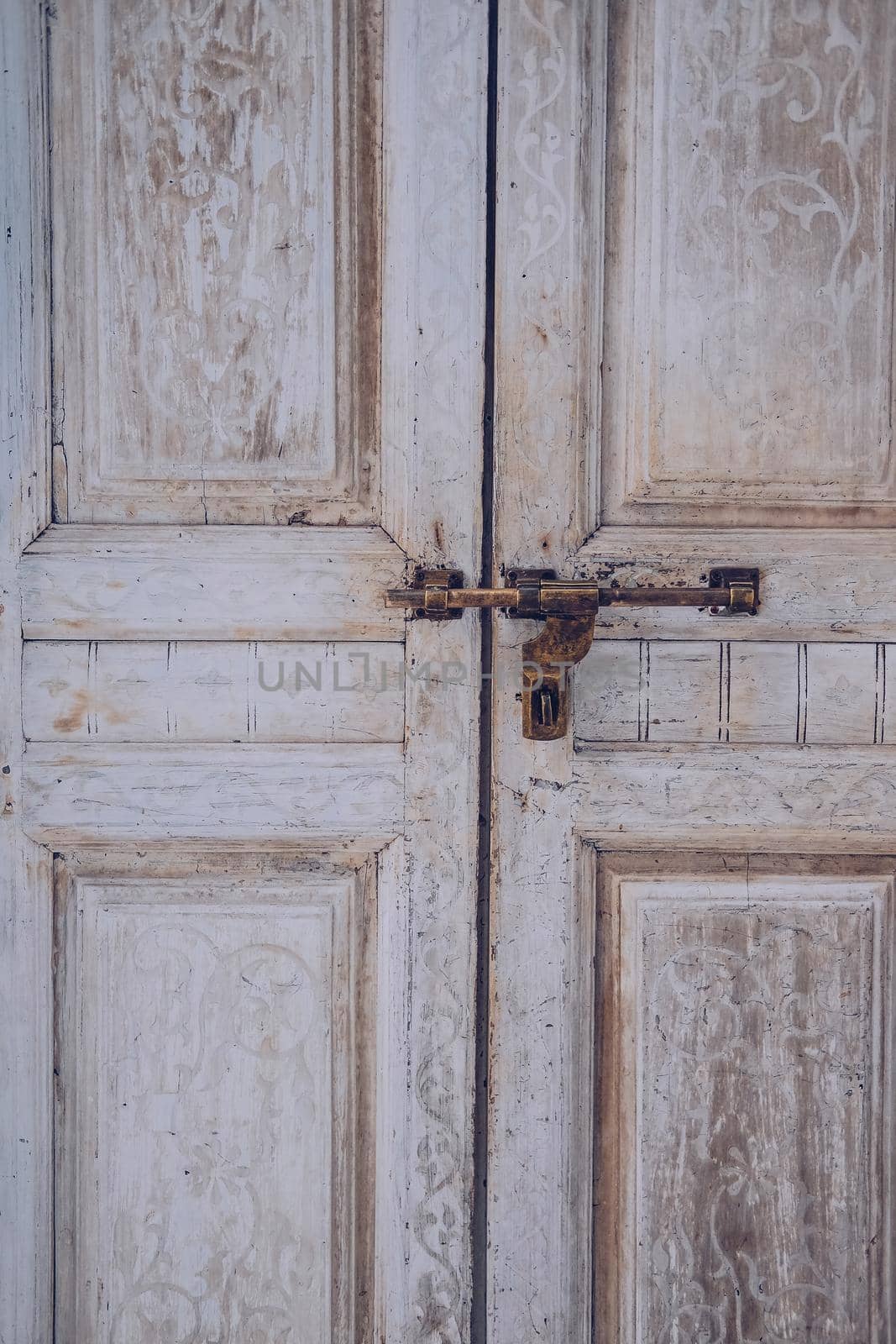 old vintage retro wooden door and retro metal locking handle lock