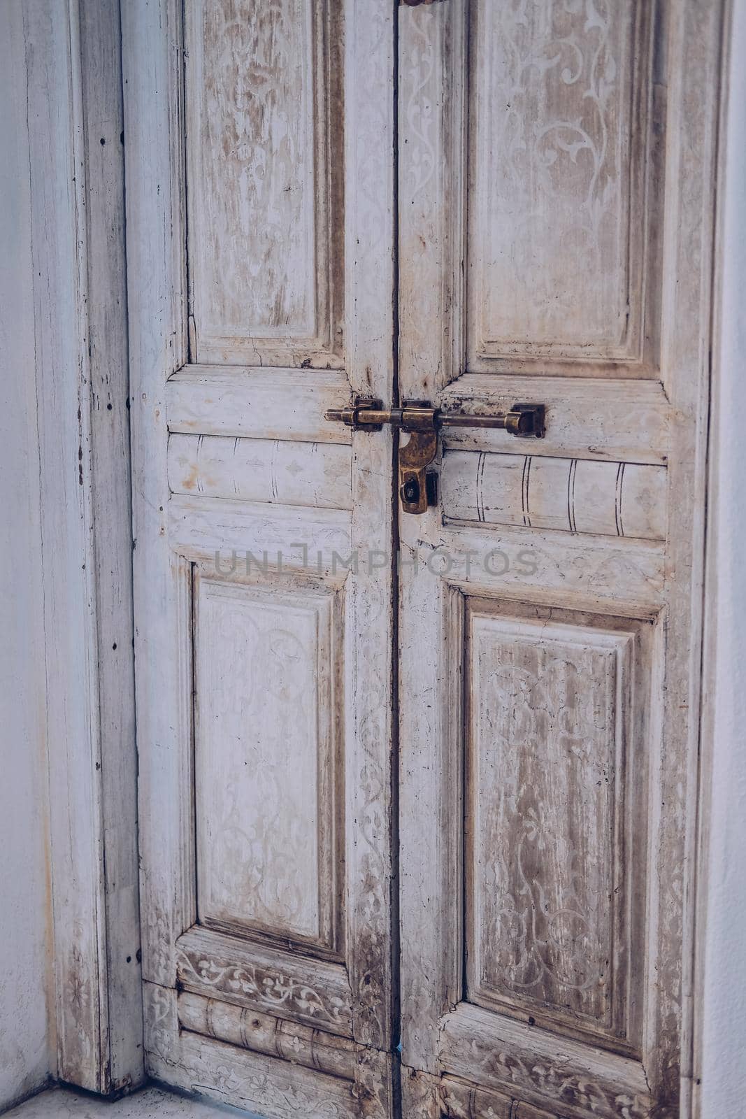 old vintage retro wooden door and retro metal locking handle lock