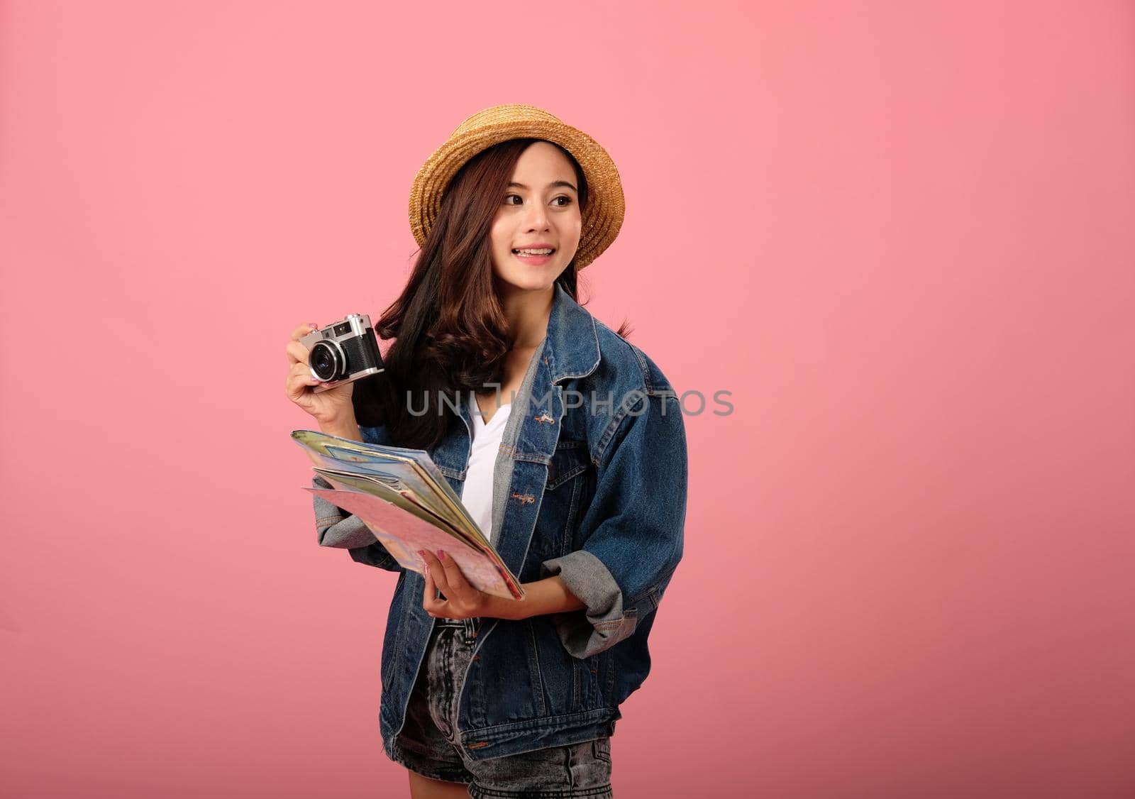 young asian woman backpacker traveler with camera map. journey trip travel. studio shot