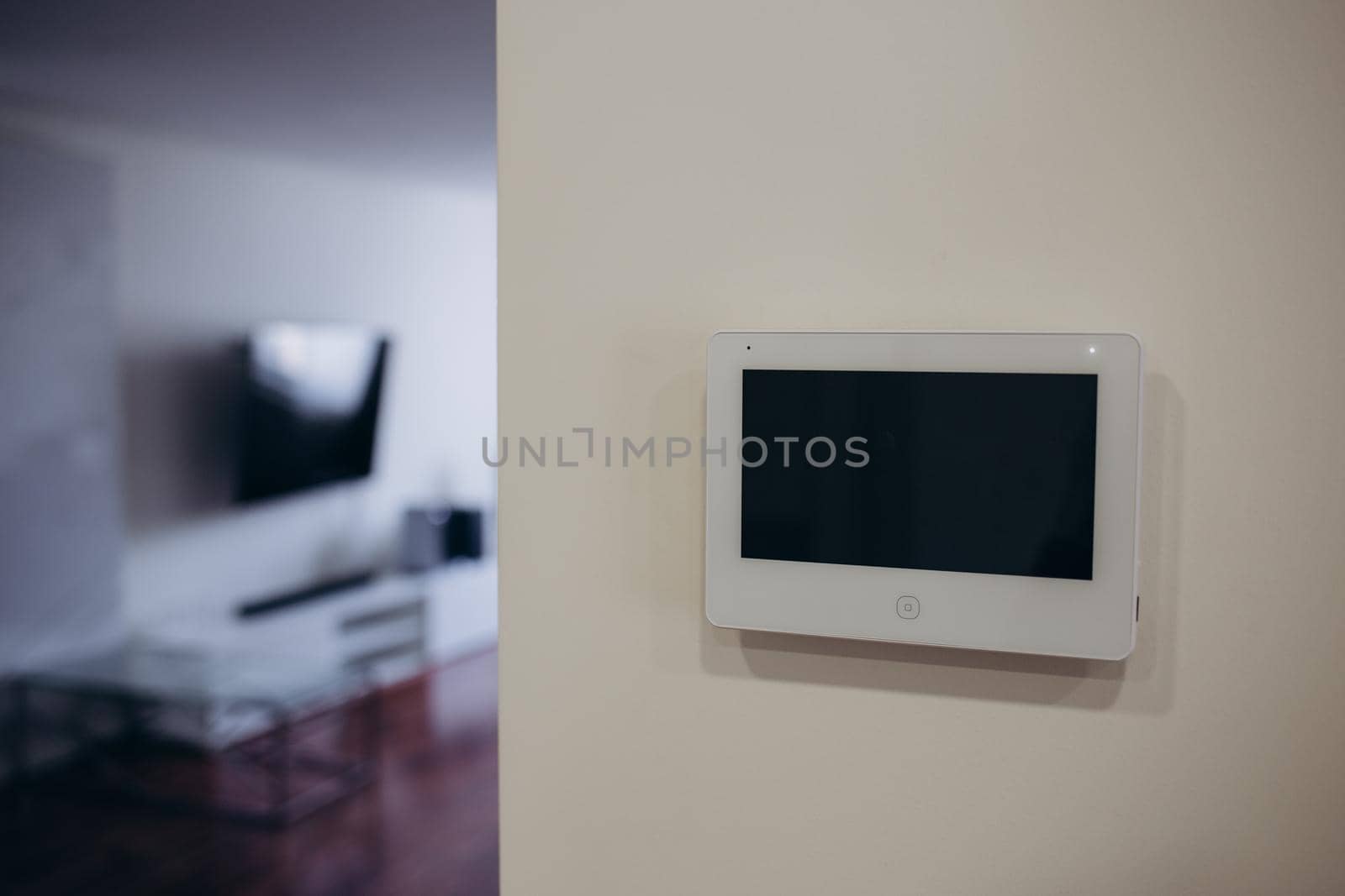 smart screen with smart home apps on wall in modern living room by fentonroma