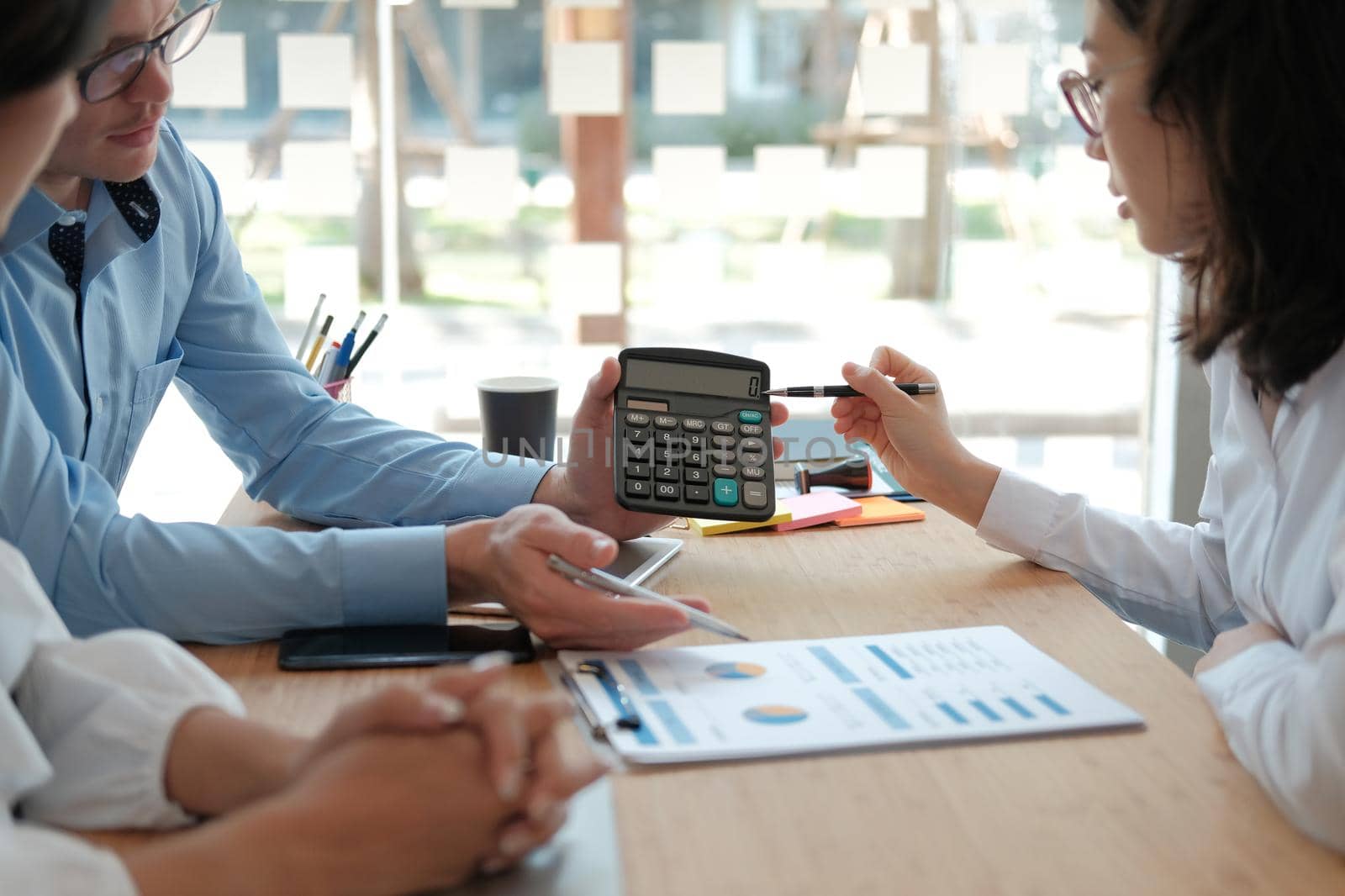 business people discussing on performance revenue in meeting. businessman working with co-worker team. financial adviser analyzing data with investor.