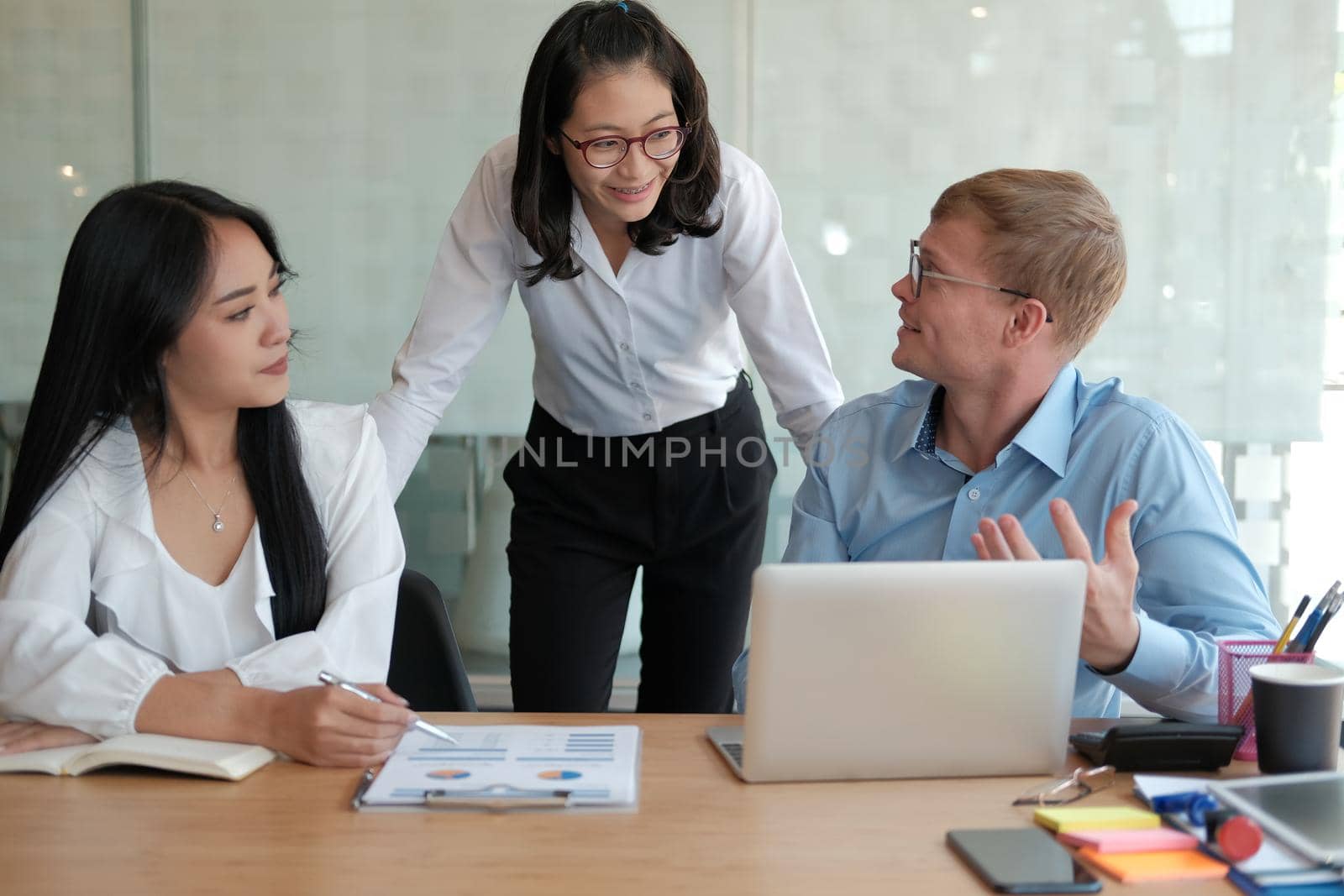 business people discussing on performance revenue in meeting. businessman working with co-worker team. financial adviser analyzing data with investor.