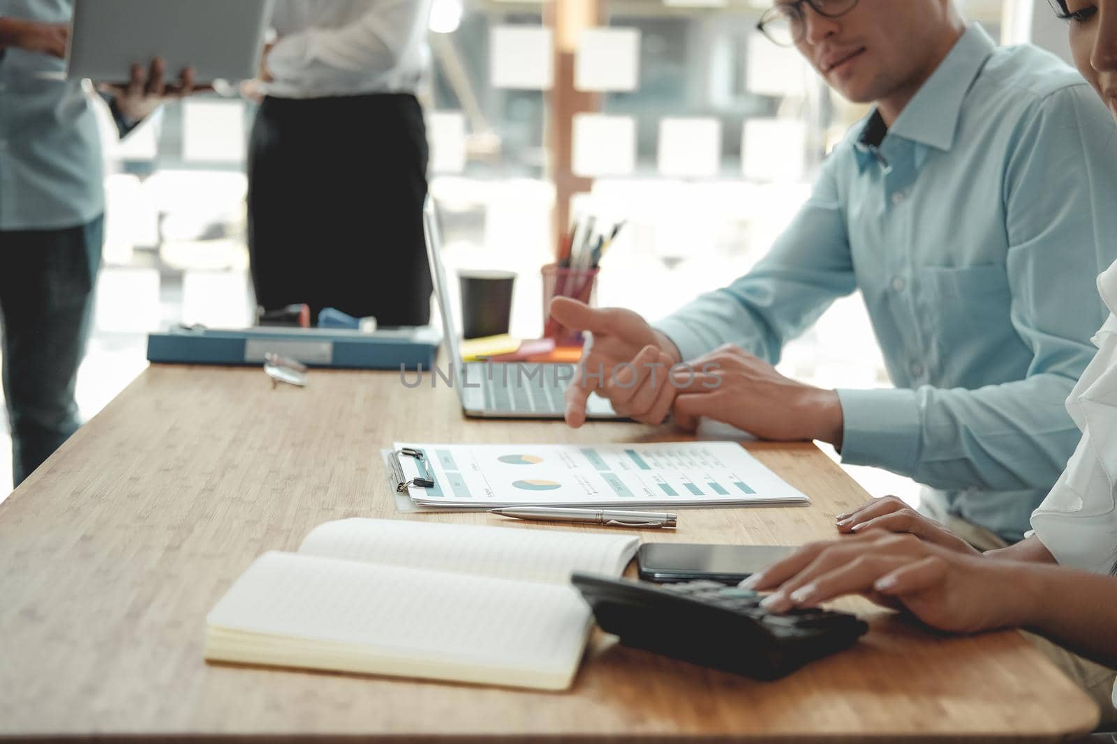 business people discussing on performance revenue in meeting. businessman working with co-worker team. financial adviser analyzing data with investor.