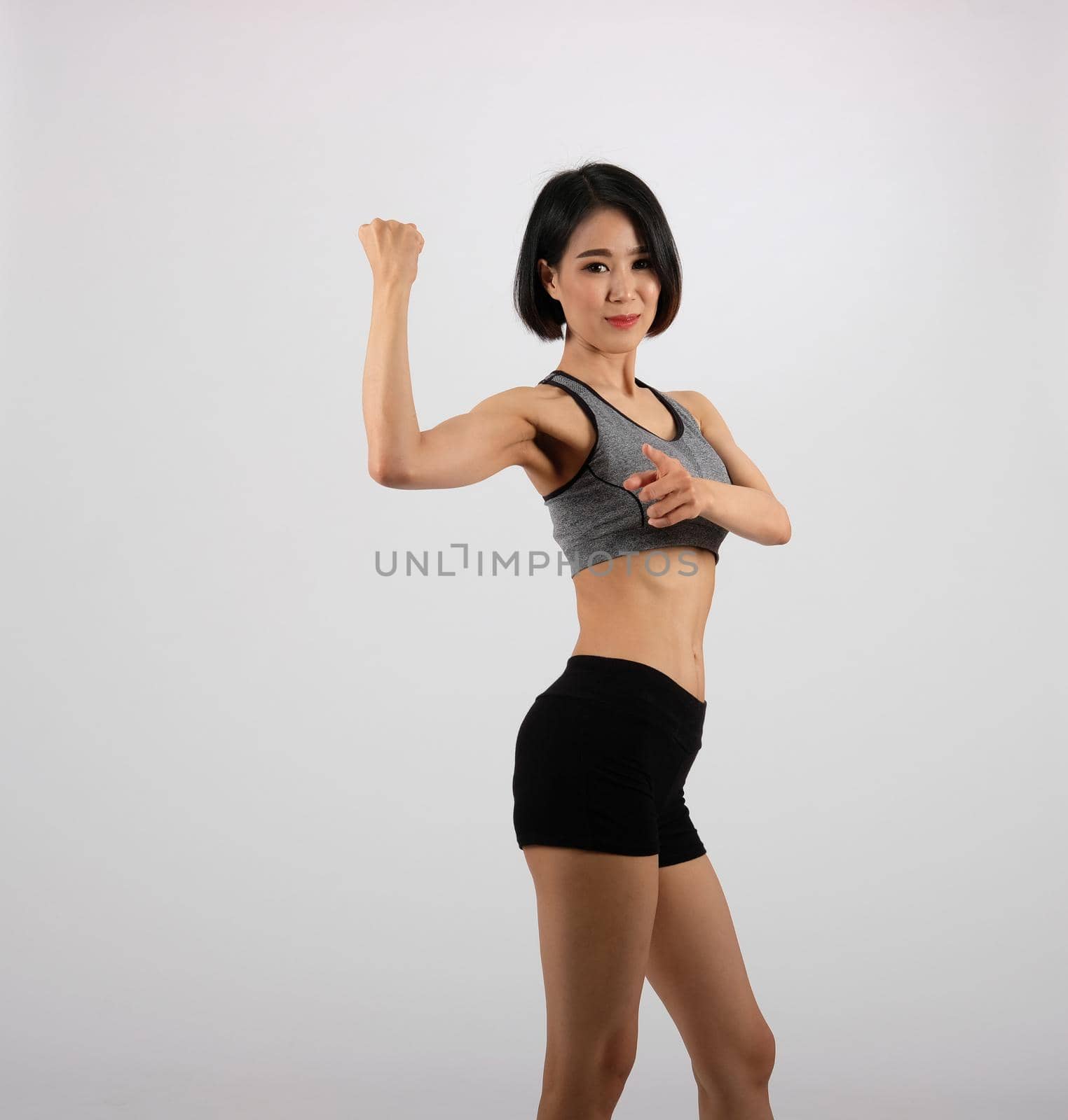 sporty fitness woman in sportswear on white background. healthy sport lifestyle