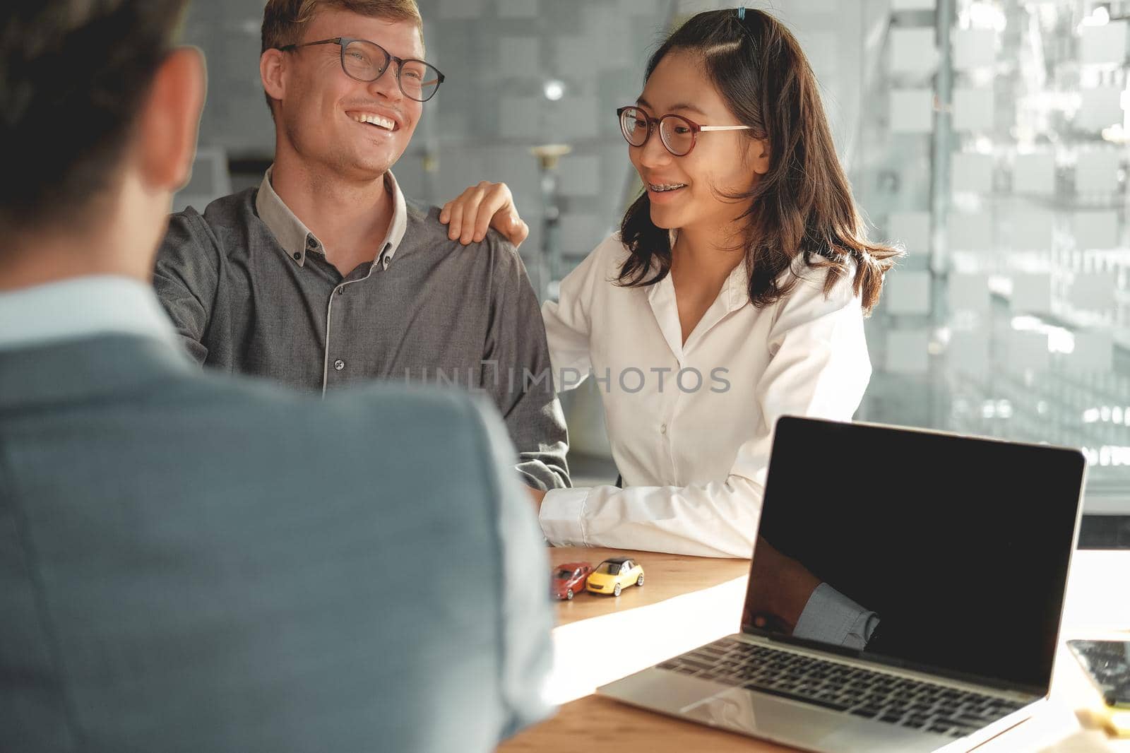couple consulting lawyer about buying renting house car. insurance broker financial advisor giving legal advice to customer.realtor selling real estate property to client