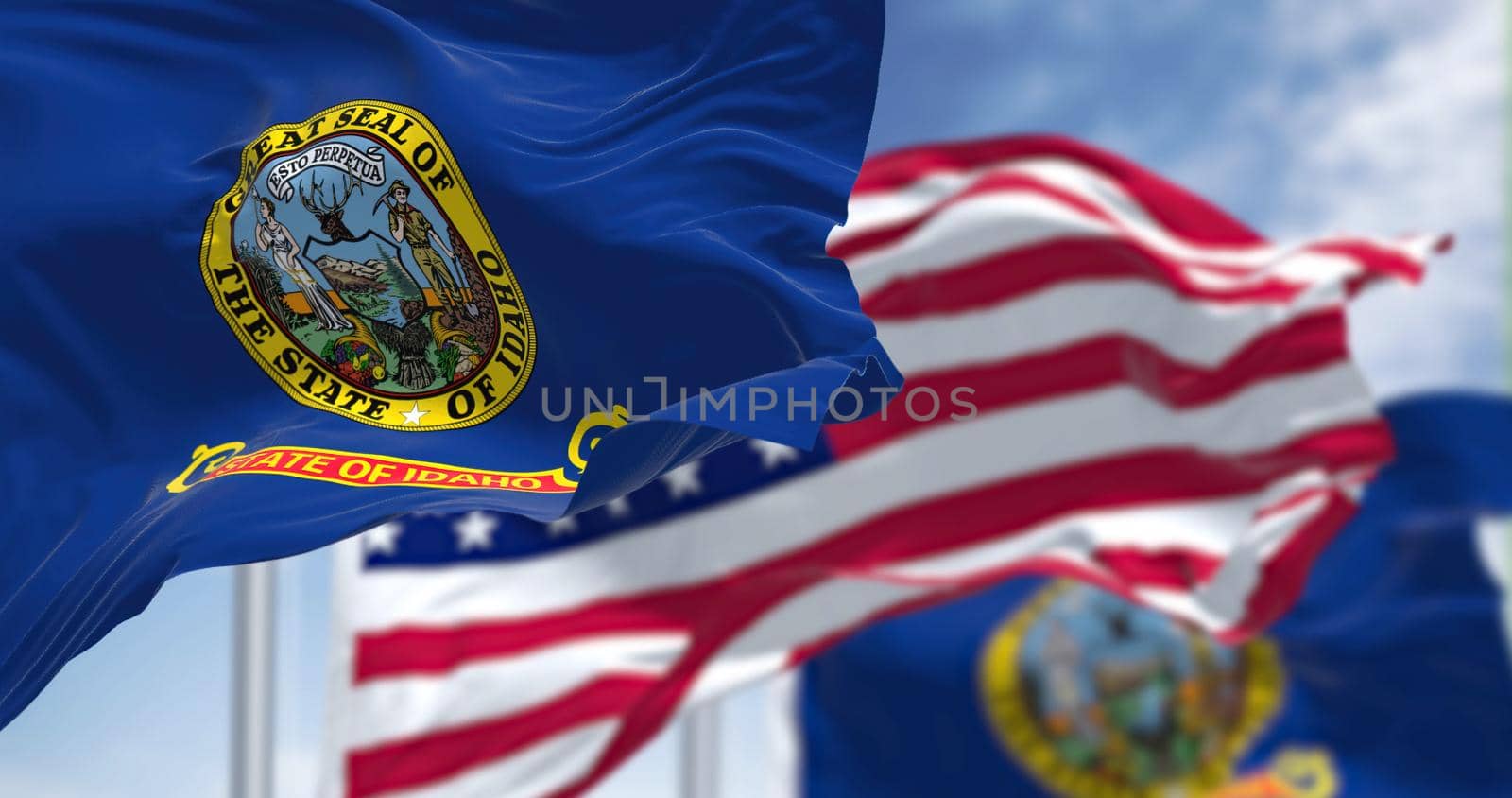 The Idaho state flag waving along with the national flag of the United States of America by rarrarorro