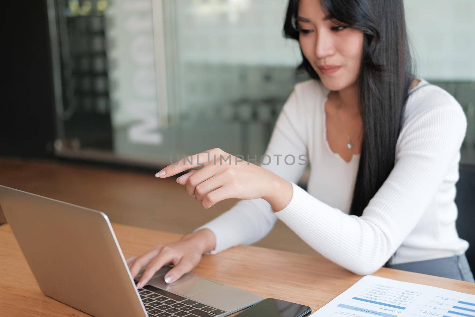 businesswoman freelancer working with computer at office. startup woman entrepreneur analyzing data at workplace. student studying doing assignment