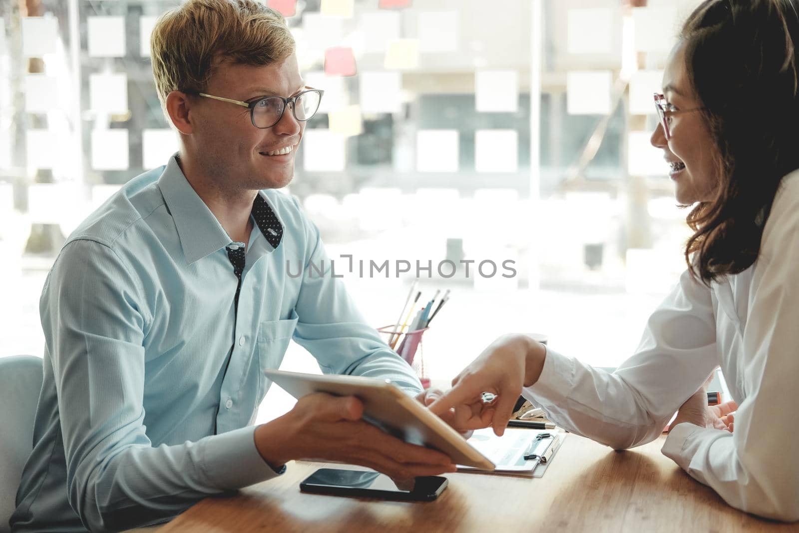 business people discussing on performance revenue in meeting. businessman working with co-worker team. financial adviser analyzing data with investor.