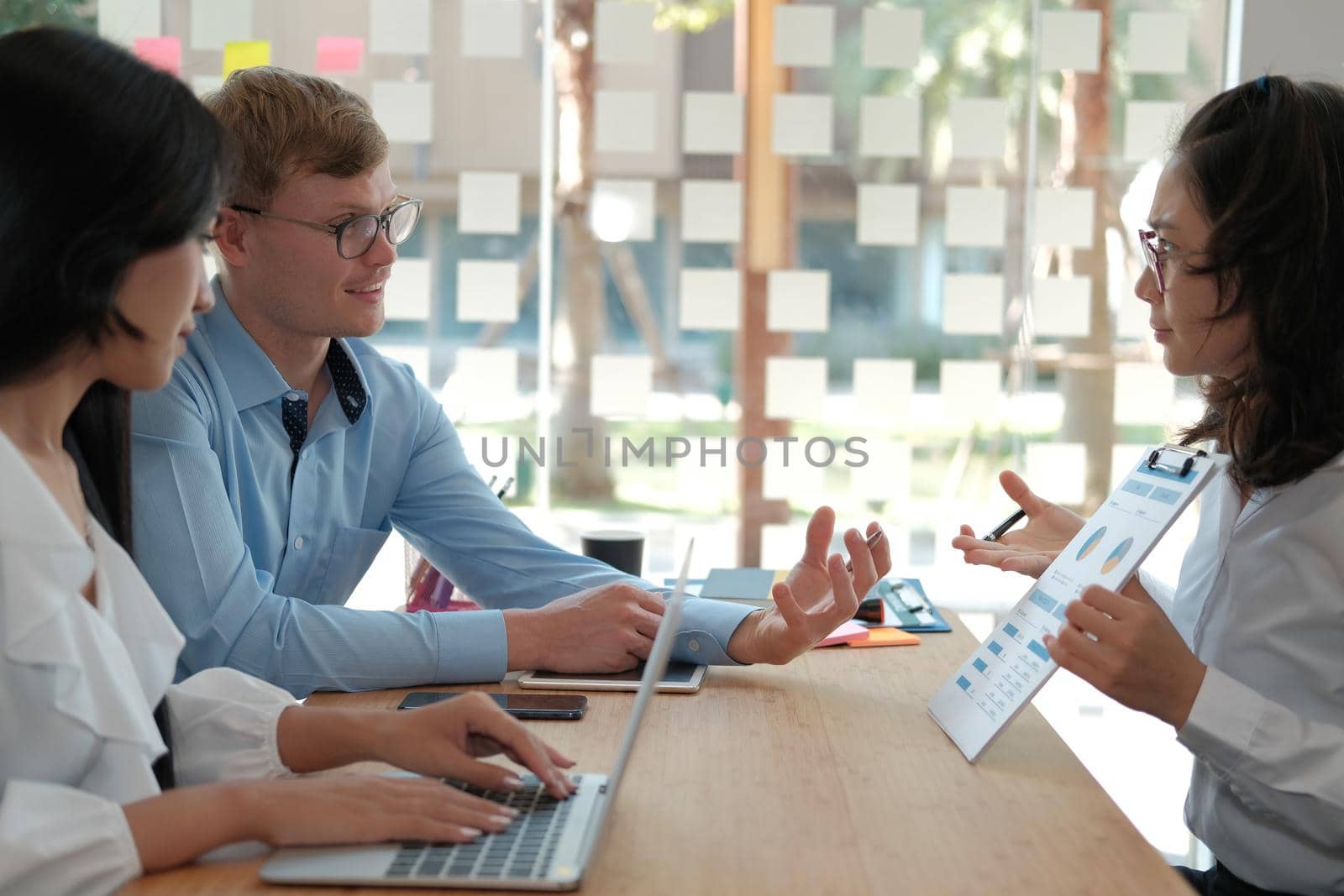 business people discussing on performance revenue in meeting. businessman working with co-worker team. financial adviser analyzing data with investor.