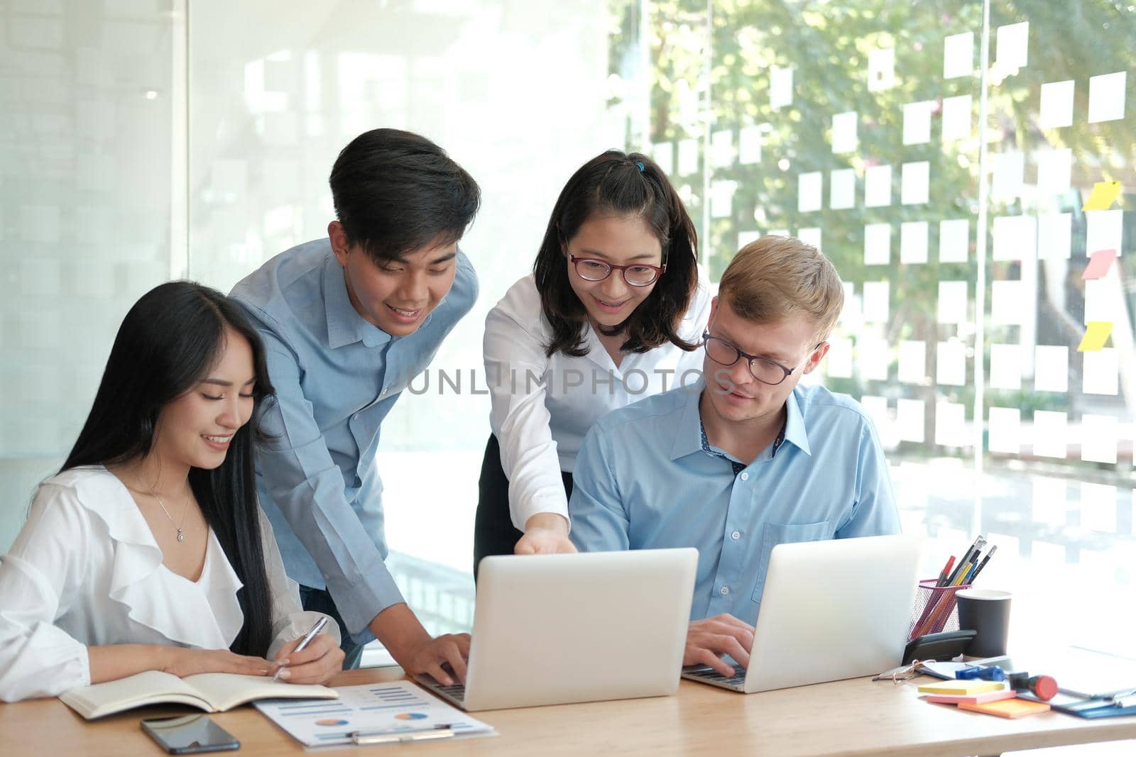 business people discussing on performance revenue in meeting. businessman working with co-worker team. financial adviser analyzing data with investor.