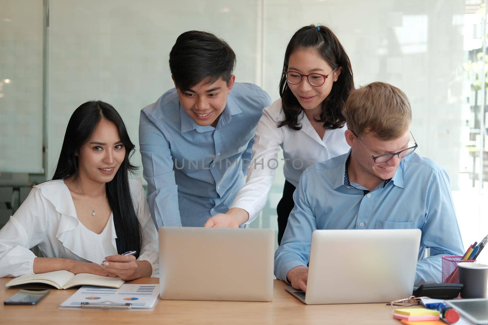 business people discussing on performance revenue in meeting. businessman working with co-worker team. financial adviser analyzing data with investor.