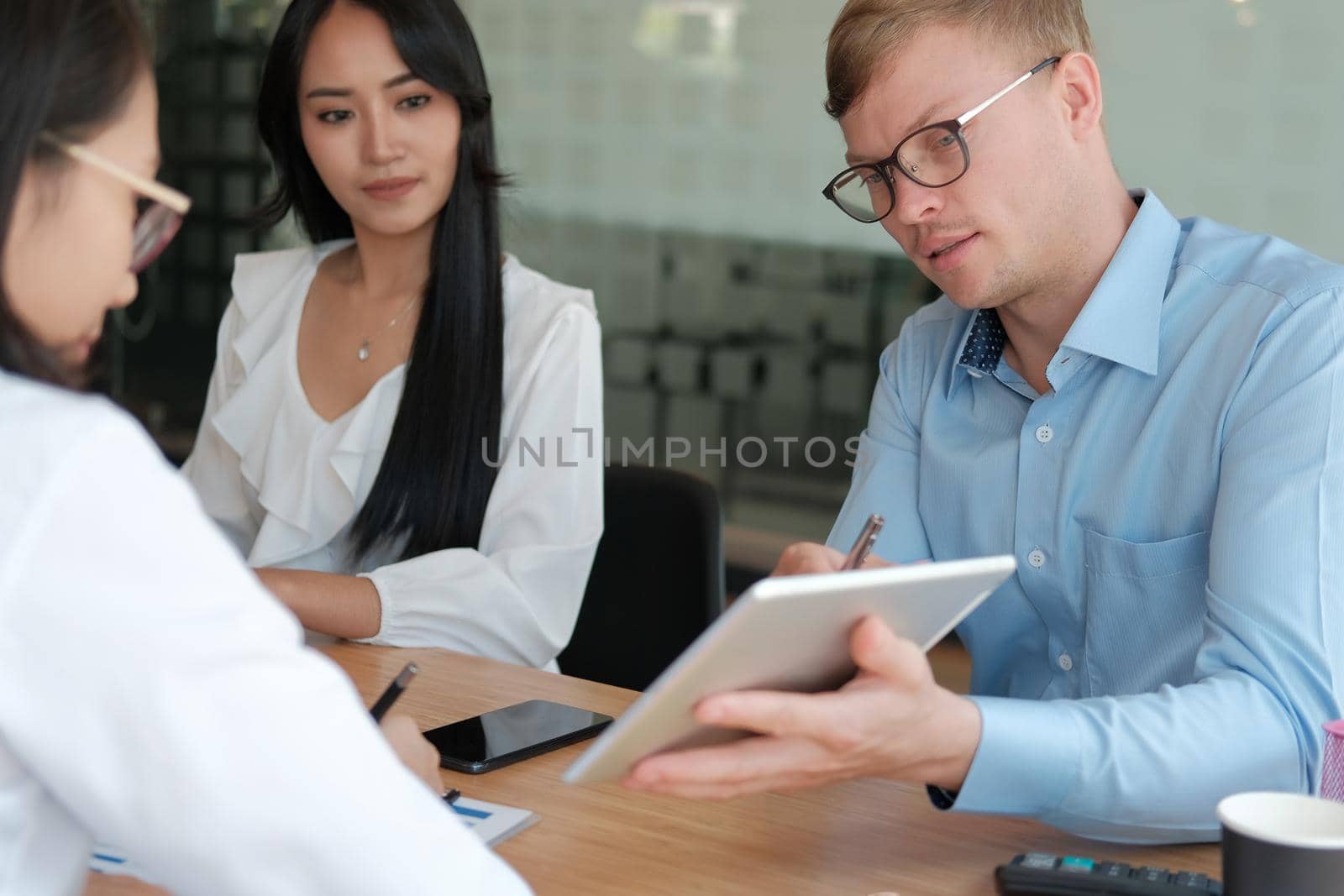 business people discussing on performance revenue in meeting. businessman working with co-worker team. financial adviser analyzing data with investor.