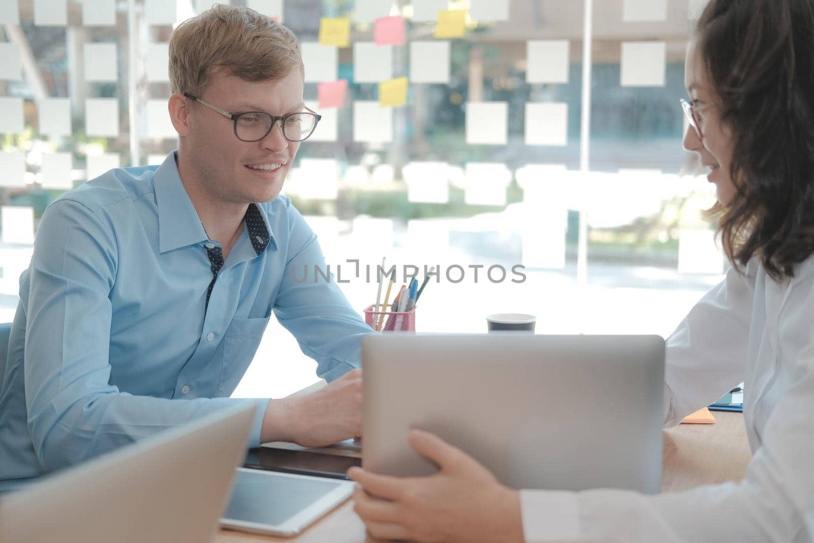 business people discussing on performance revenue in meeting. businessman working with co-worker team. financial adviser analyzing data with investor.