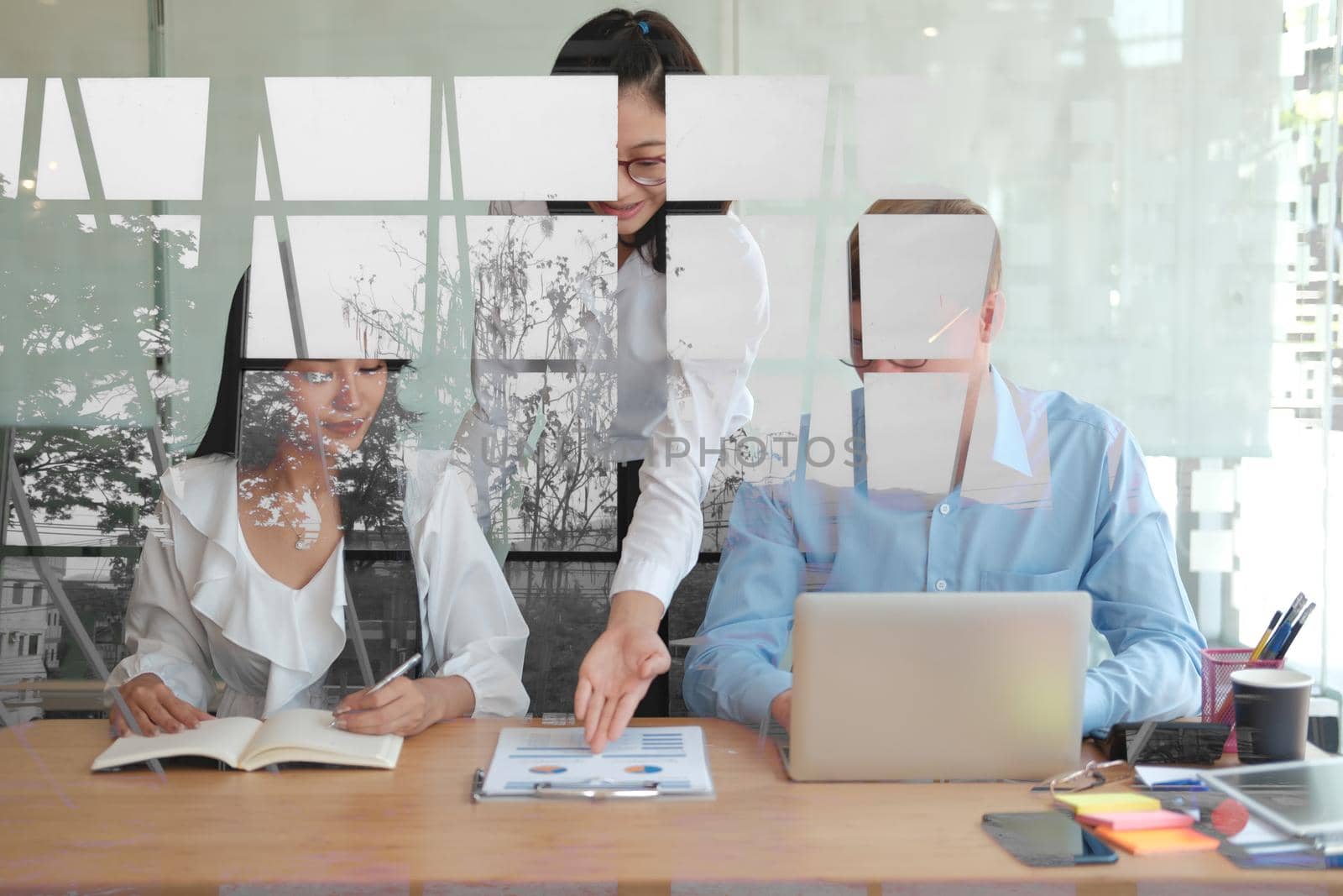 business people discussing on performance revenue in meeting. businessman working with co-worker team. financial adviser analyzing data with investor.