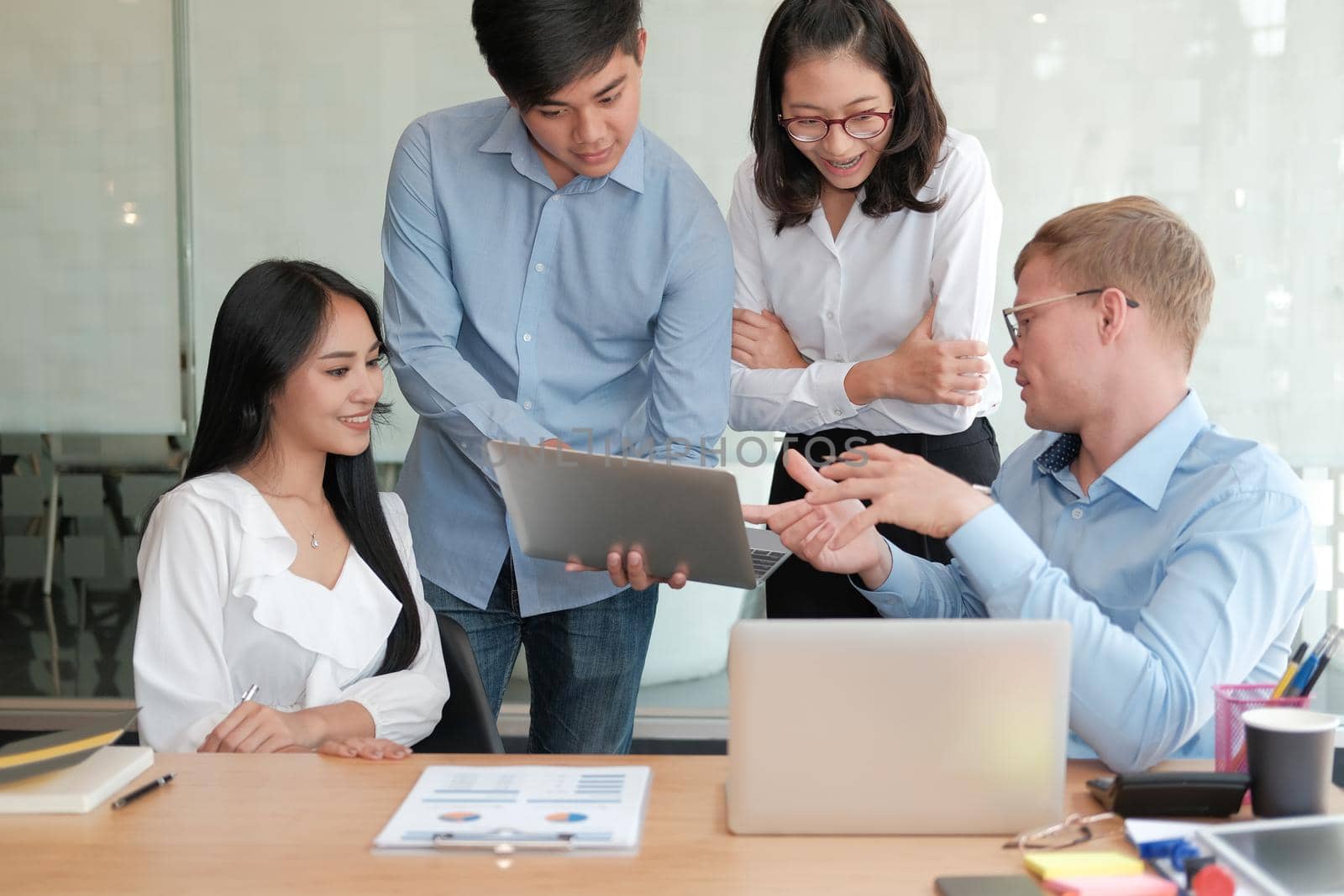 business people discussing on performance revenue in meeting. businessman working with co-worker team. financial adviser analyzing data with investor.