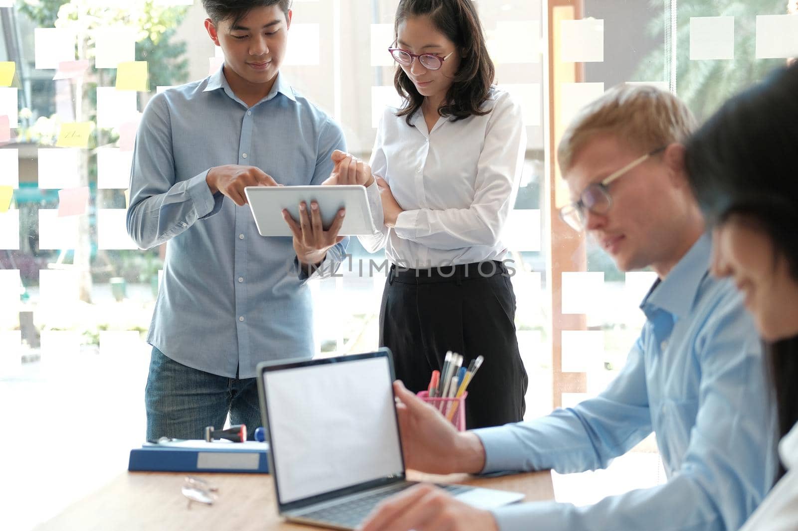 business people discussing on performance revenue in meeting. businessman working with co-worker team. financial adviser analyzing data with investor.