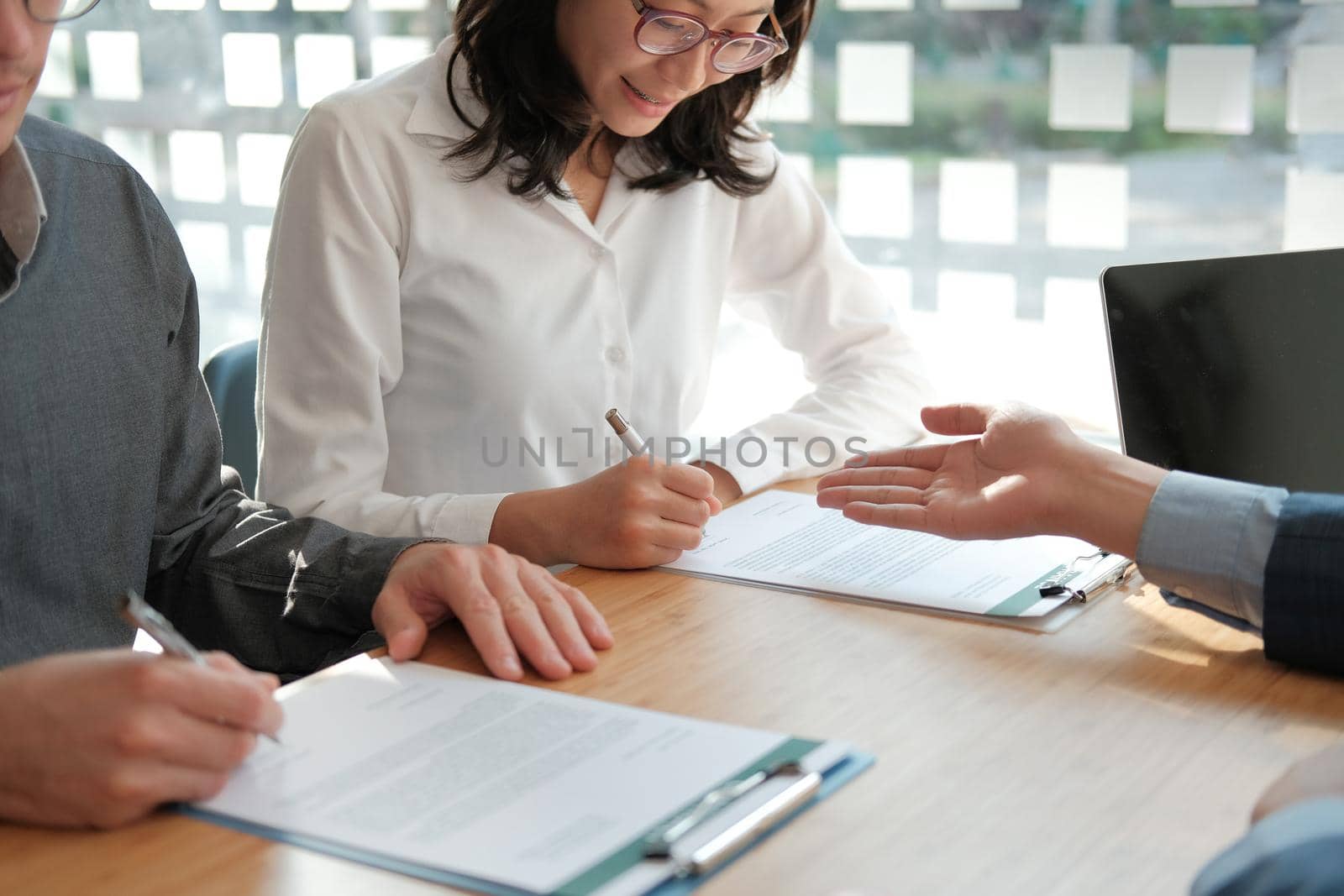 couple buying renting house car signing mortgage insurance purchase order contract with realtor real estate agent. architect designer closing dealing with customer