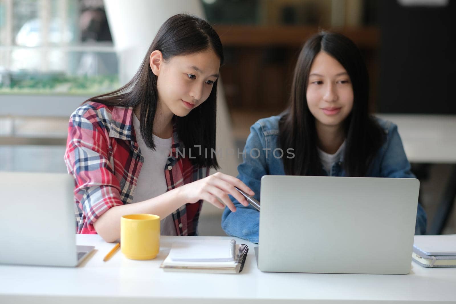 girl teenager college high school student studying with computer laptop