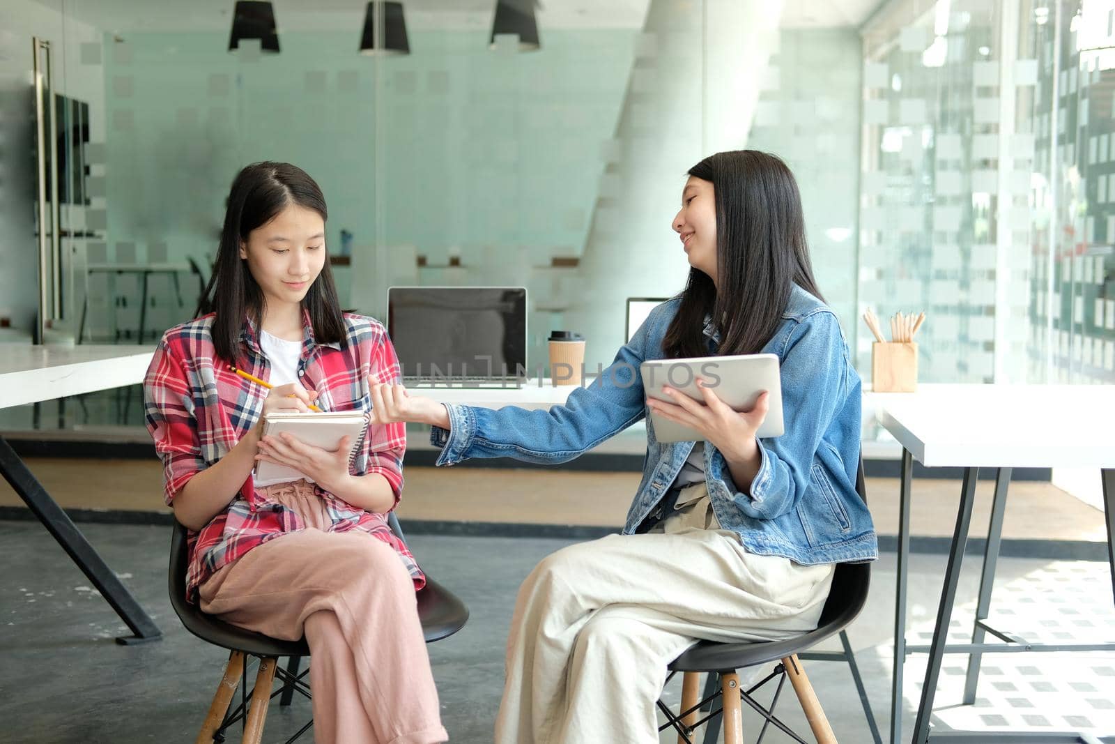 girl teenager studying with tablet .college high school student taking notes