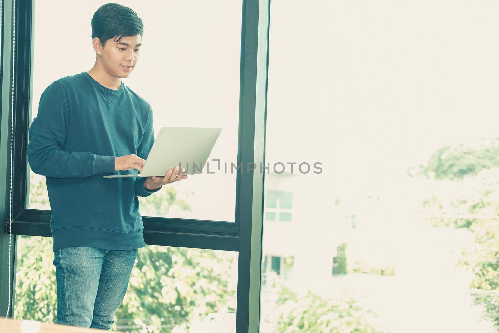 startup male freelancer working with computer at office. man entrepreneur analyzing data at workplace. student studying doing assignment