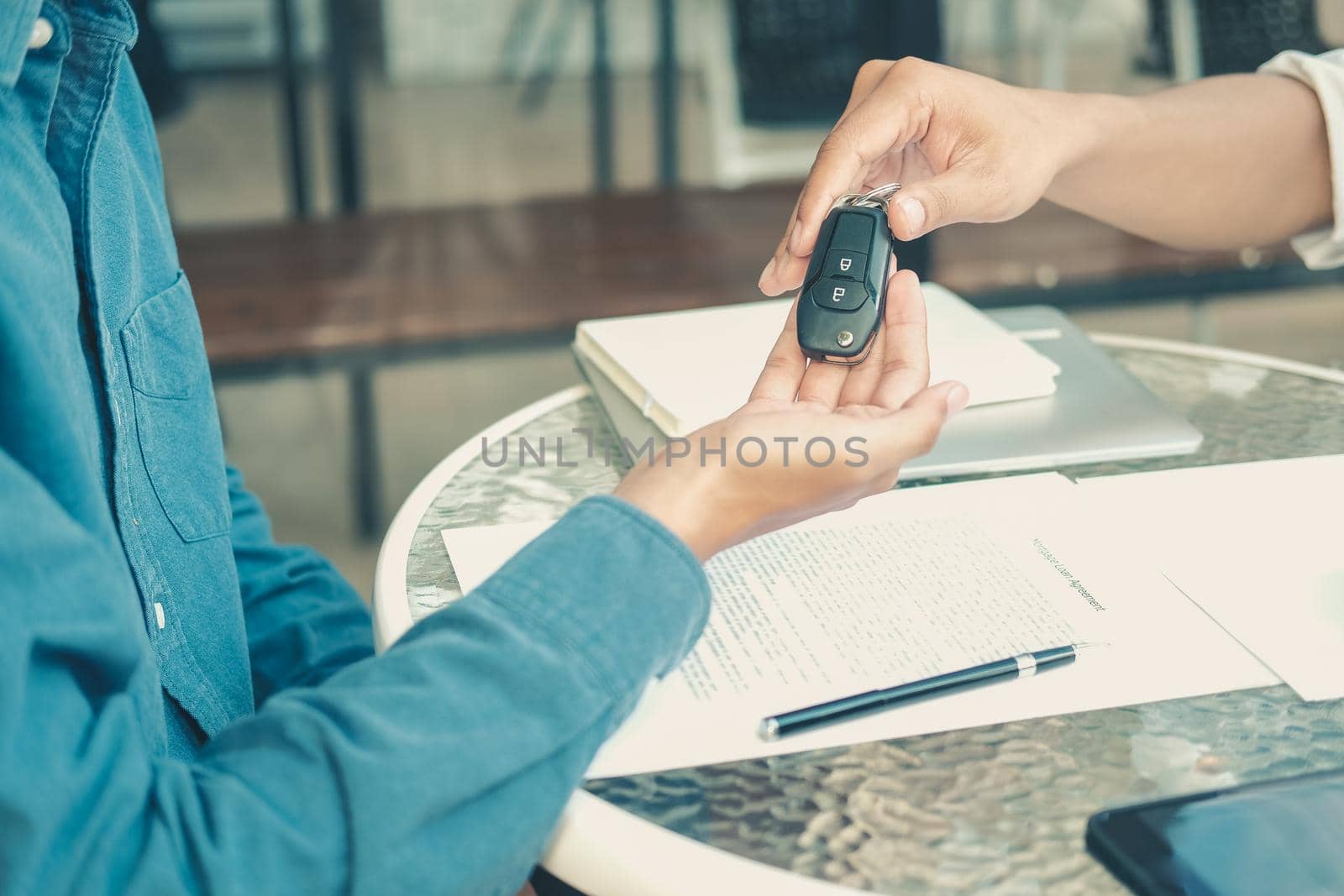 salesman dealer giving car key to new owner. car sale & dealership in auto business