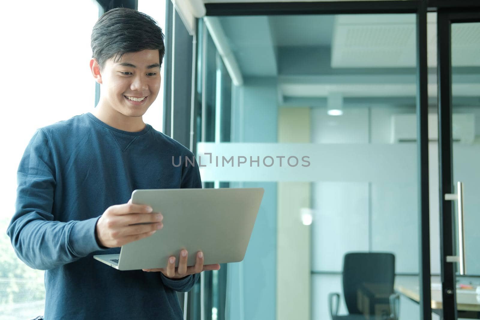 startup male freelancer working with computer at office. man entrepreneur analyzing data at workplace. student studying doing assignment