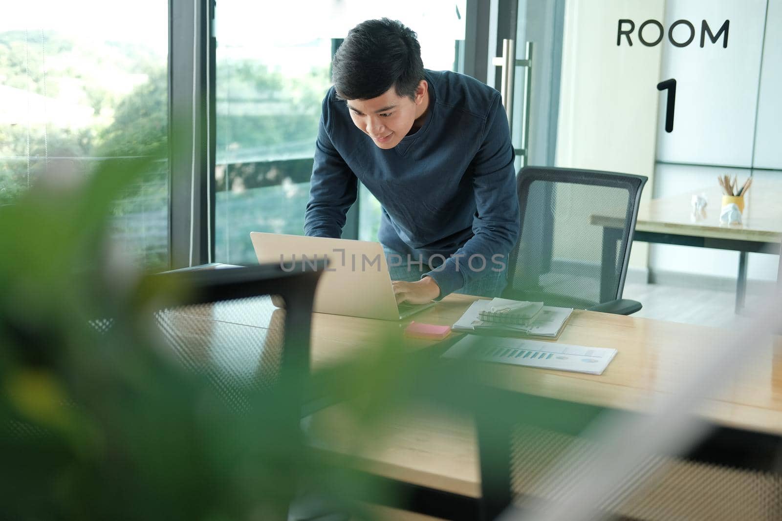 startup male freelancer working with computer at office. man entrepreneur analyzing financial performance at workplace. student studying doing assignment