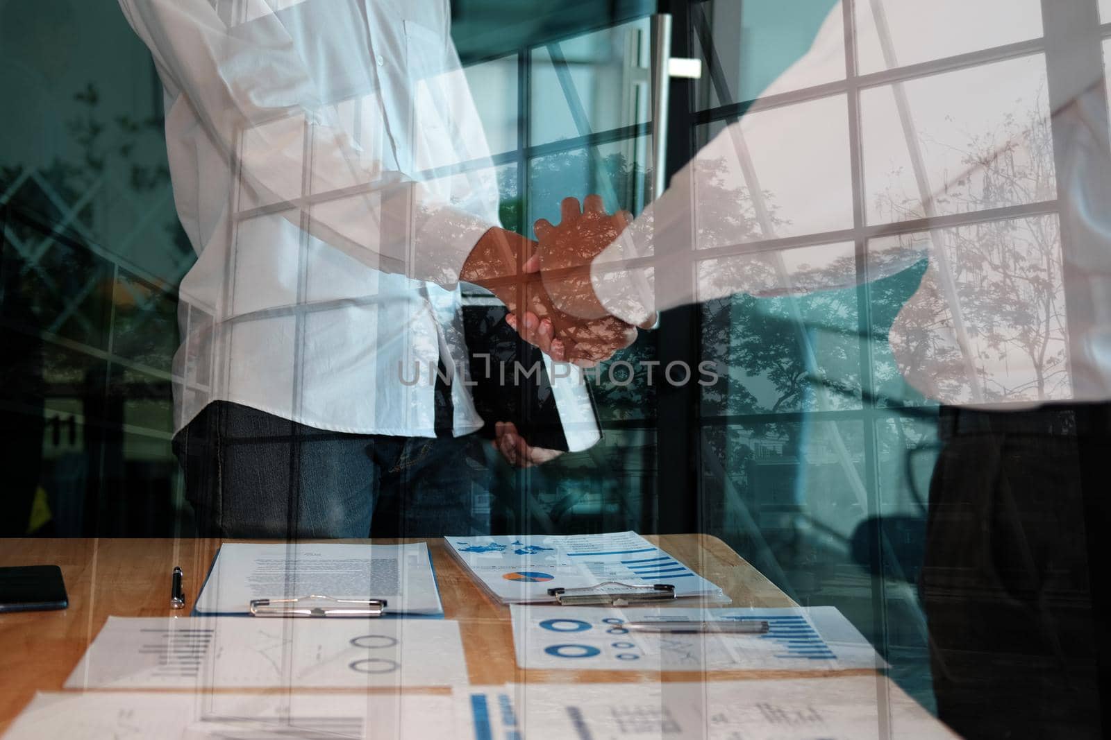 businessman shaking hands after meeting. Business people handshaking. Greeting deal, teamwork partnership concept.