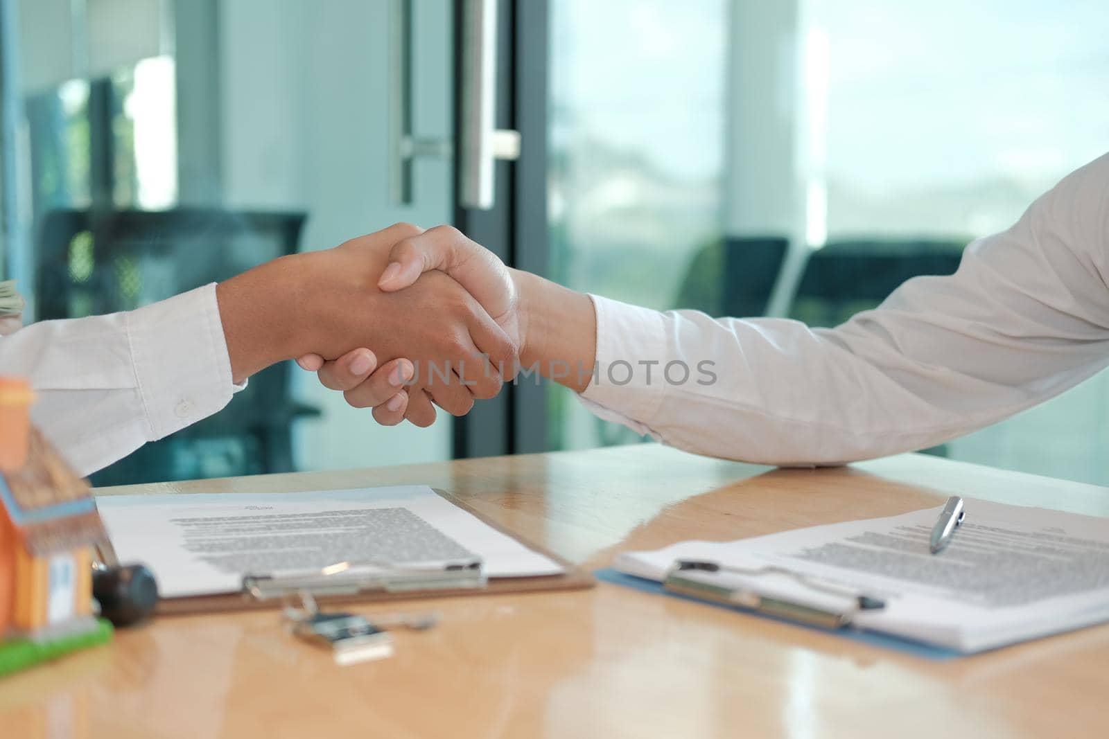 client shaking hands to realtor mortgage insurance broker lawyer. customer handshaking with financial advisor for advice, making investment deal