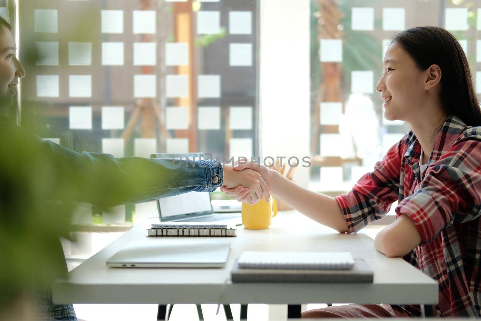 asian girl teenager friends shaking hands for startup project. teamwork, friendship concept