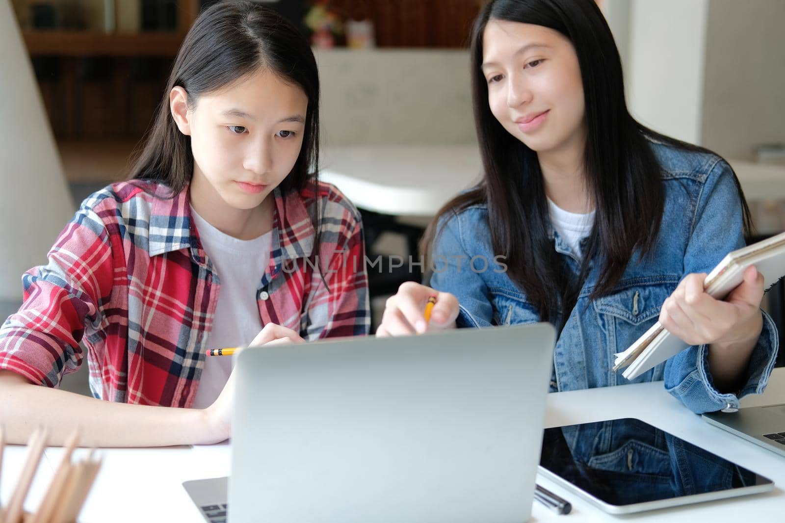 girl teenager college high school student studying with computer laptop