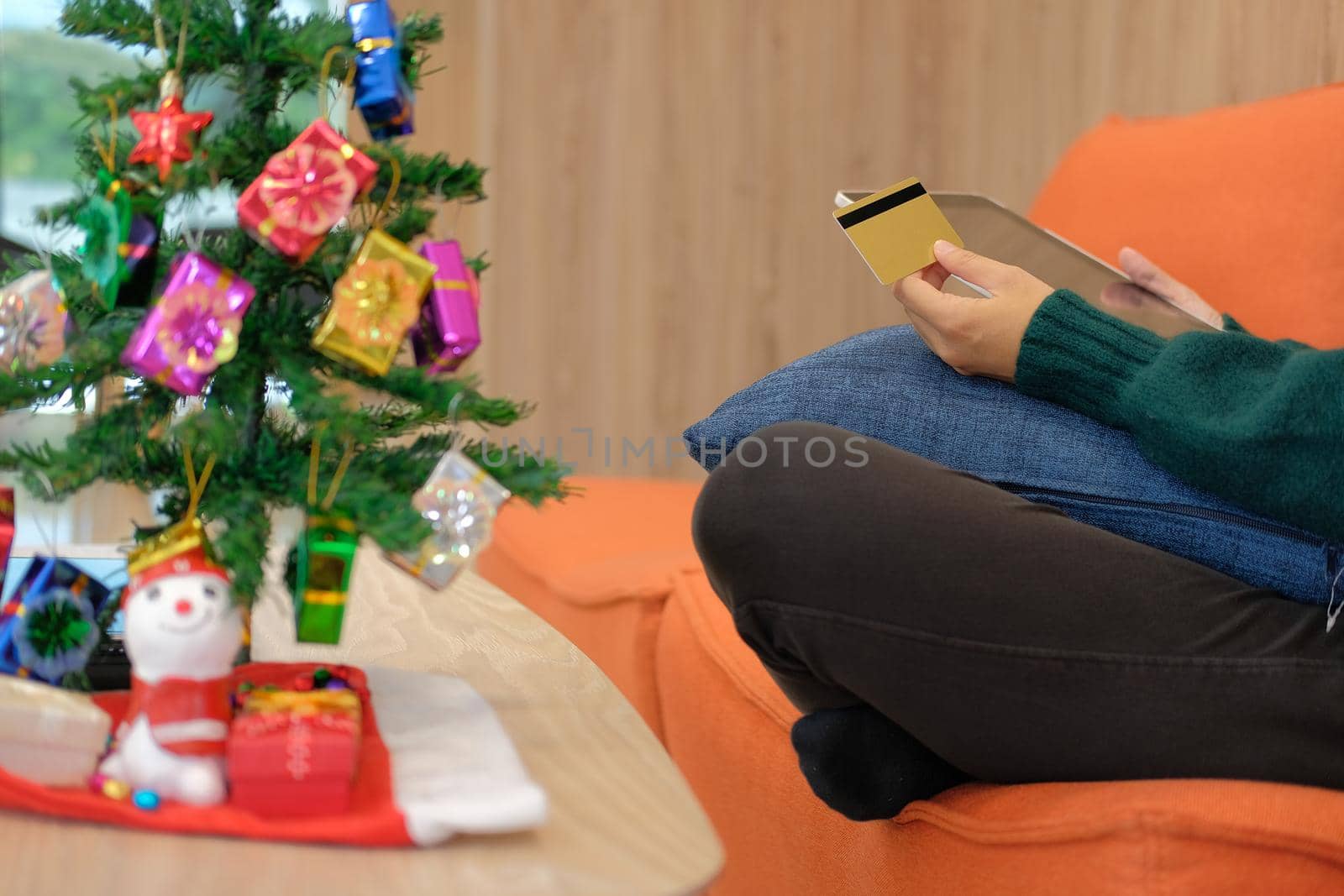woman hold credit card & tablet for online shopping.  female buyer buying christmas gift on internet. new year holiday merry xmas celebration by pp99