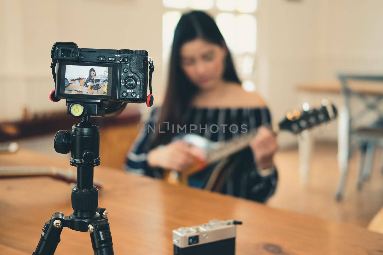 blogger live broadcasting music instrument tutorial on social media. vlogger recording online vlog video.  by pp99