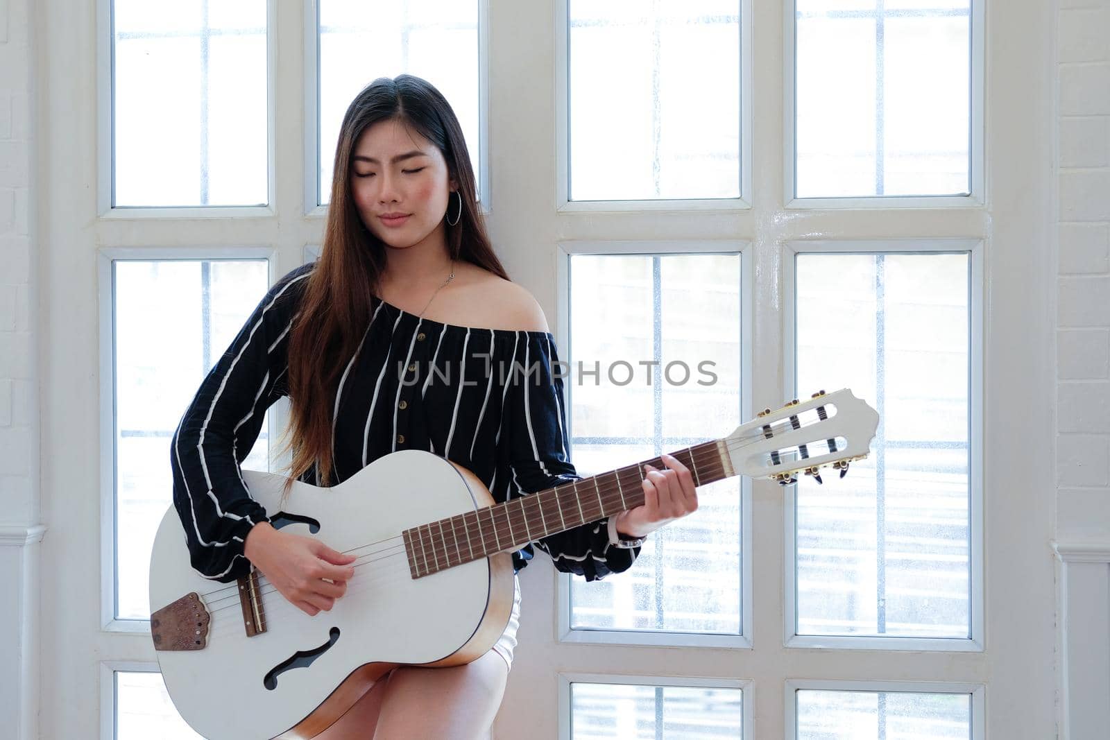 woman playing guitar. leisure lifestyle concept  by pp99