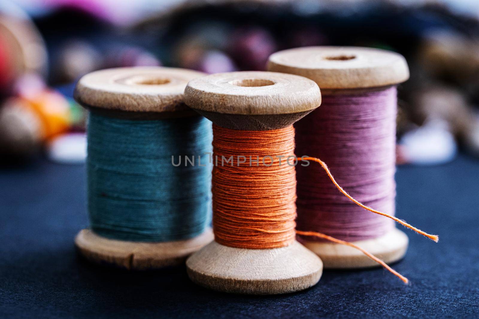 Colorful retro threads on wooden bobbins