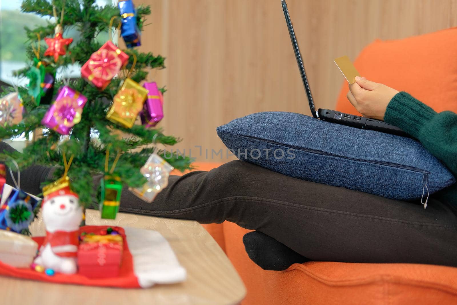 woman holding credit card for online shopping.  female buyer buying christmas gift on internet. new year holiday merry xmas celebration