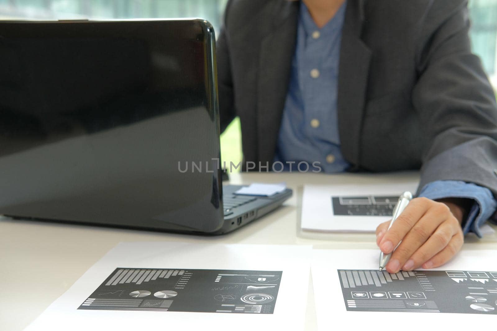 startup businessman working with business document at office. man entrepreneur analyze market data at workplace.