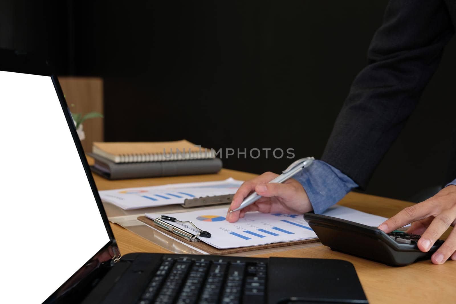 financial adviser working with calculator, business document at office. accountant doing accounting & calculating revenue & budget. bookkeeper making calculation. finance & economy concept