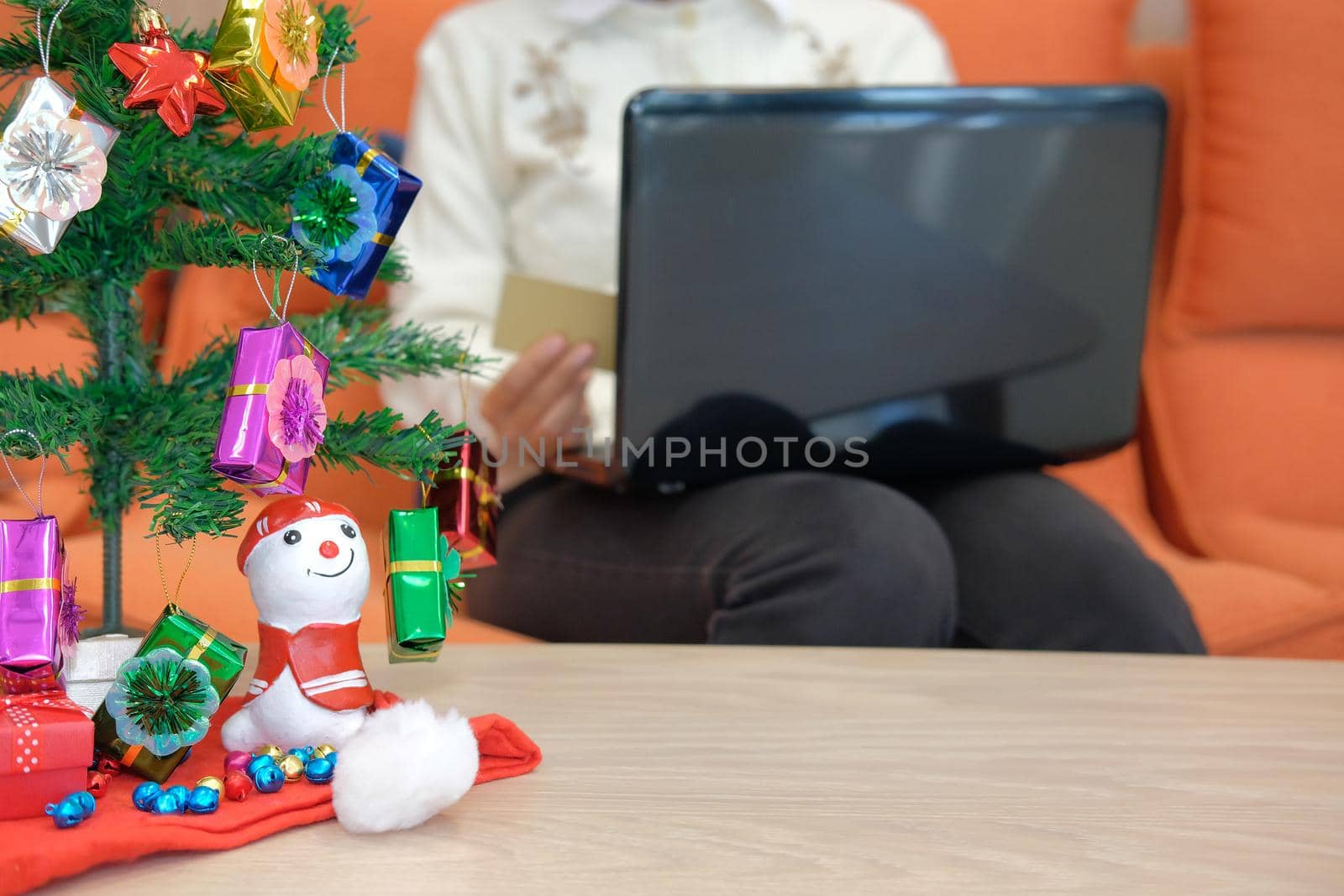woman holding credit card for online shopping.  female buyer buying christmas gift on internet. new year holiday merry xmas celebration