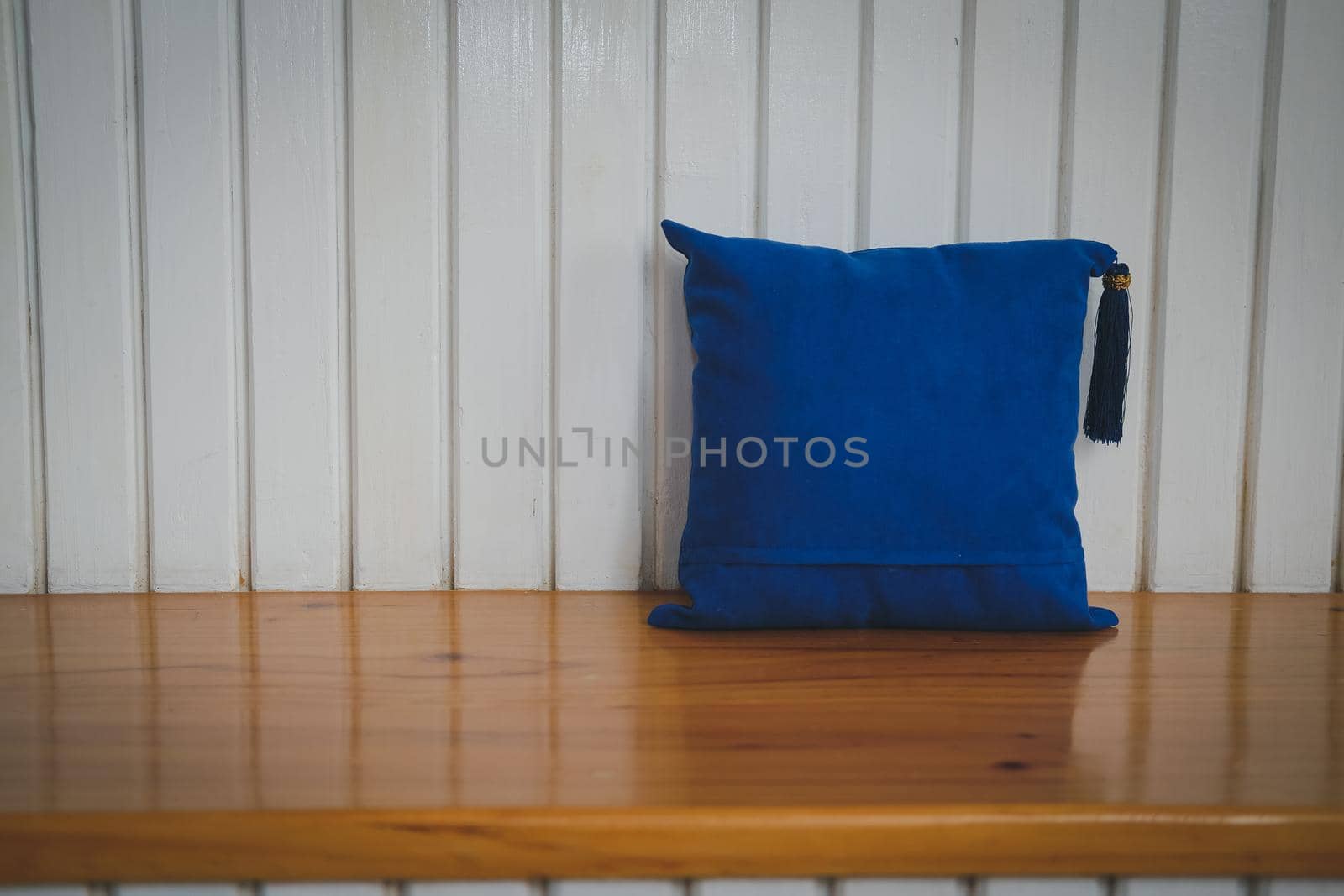 blue pillow on white wood chair in cozy living room