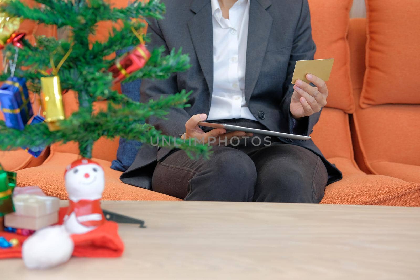 woman holding credit card & tablet for online shopping.  businesswoman buying christmas gift on internet. new year holiday merry xmas celebration