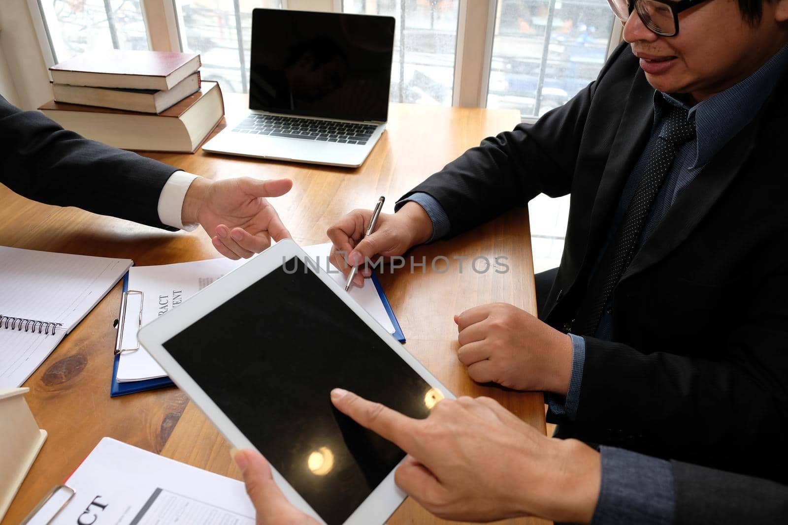 businessman consulting lawyer & signing contract agreement. team meeting at law firm